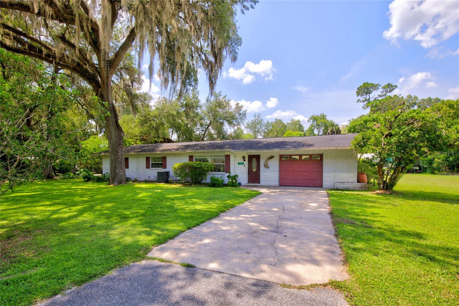 Welcome to your own private retreat in Dunnellon! Situated on just under 0.7 acres at the end of a quiet dead-end street, and less than 5 minutes from DOWNTOWN Dunnellon, this beautifully maintained 3-bedroom, 2-bath concrete block home is the perfect combination of privacy, functionality, and outdoor living. From the moment you arrive, you'll appreciate the beautiful landscaping and exceptional curb appeal that make this property feel like home. The interior offers a warm and inviting feel with brand-new flooring, making this home CARPET FREE. You'll also appreciate the gas range in the Kitchen, spacious living areas, and oversized guest bedrooms that provide comfort for everyone. The garage has been partially converted into an additional flex room, providing extra living space while still offering the option to easily convert it back into a full garage if desired.
Step outside and discover your own backyard oasis. Whether you're entertaining friends or unwinding after a long day, you'll love relaxing under the GAZEBO, soaking in the HOT TUB, or just enjoying the peace this home showcases. The property also features a workshop with electricity already connected, an additional carport, and plenty of room for hobbies, storage, or outdoor equipment. Additional upgrades include a 2022 HVAC system and a tankless water heater, offering comfort and efficiency for years to come.
If you've been looking for a move-in ready home with land, privacy, and an incredible outdoor space to enjoy, this property checks all the boxes. Don't miss your opportunity to make it yours!