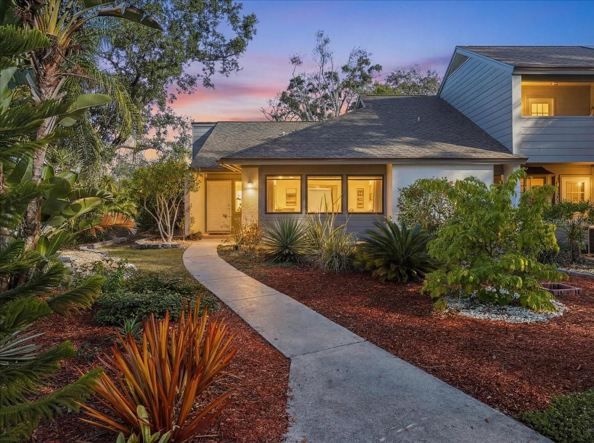 PRICE IMPROVEMENT!  Eagle Chase Villa – Sarasota.  Ideally positioned in the desirable Eagle Chase community, this impeccably upgraded 2-bedroom, 2-bath villa offers 1,268 square feet of thoughtfully enhanced living space just minutes from beaches, nature, shopping, and downtown Sarasota. Located within walking distance to the 84-acre Red Bug Slough Nature Preserve and only 2.1 miles to Crescent Beach and 3 miles to Siesta Key, this home delivers the perfect blend of location, quality, and peace of mind. Inside, the residence reflects years of careful investment and pride of ownership, with over $125,000 in renovations and improvements completed since 2020. The home has undergone extensive mechanical and structural upgrades, including a near full plumbing re-pipe with the removal of old cast iron and replacement with CPVC, new electrical breakers, all-new outlets, plate covers, and modern dimmable LED lighting throughout. HVAC systems have been replaced and professionally serviced twice yearly, the roof was replaced in 2022, and impact-rated windows and doors were installed for comfort, efficiency, and storm protection. The kitchen has been beautifully updated with quartz countertops, painted cabinetry with new hardware, tile backsplash, LED under-cabinet lighting, an upgraded oven range, undermount sink, and newer appliances, creating a bright and functional space that flows effortlessly into the living areas. Both bathrooms were fully remodeled down to the studs with waterproofing, new drain lines, Moen fixtures, custom tile, rain shower heads, quartz vanities, beveled window detail in the primary bath, and LED lighting with dimmers, offering a spa-like experience. Living space was thoughtfully expanded with the creation of a stunning Florida Room, replacing the former lanai and deck. This space features impact sliding doors and windows, reinforced flooring, custom Italian tile, fresh paint, updated electrical, and a ceiling fan with remote, seamlessly blending indoor and outdoor living. New composite decking was added on a reinforced foundation along the rear of the home, with additional composite decking on the side porch, while the exterior rear stucco wall was repainted for a polished finish. Additional enhancements include plantation shutter doors throughout the hallways, bedrooms, and primary bath, refreshed interior doors and hardware, updated flooring in the primary bedroom, attic flooring for storage, and a mounted 65" Sony flat-screen TV with in-wall wiring that will convey. The home has also been meticulously maintained with comprehensive termite prevention, Sentricon bait systems, and ongoing annual inspections showing zero termite activity. Outside, the property has been transformed into a serene, park-like setting with engineered paver stone retaining walls designed to enhance drainage, extensive hardscape and landscaping improvements, indigenous Florida plantings, fruit trees, pollinator-friendly gardens, and low-maintenance decorative stone features. The location offers exceptional convenience with nearby shopping, easy access to I-75, downtown Sarasota, Venice, St. Petersburg, Tampa, and Clearwater, making this home ideal as a primary residence or refined coastal retreat. This Eagle Chase villa stands apart for its depth of upgrades, quality craftsmanship, and unmatched proximity to Sarasota’s best natural and coastal amenities.