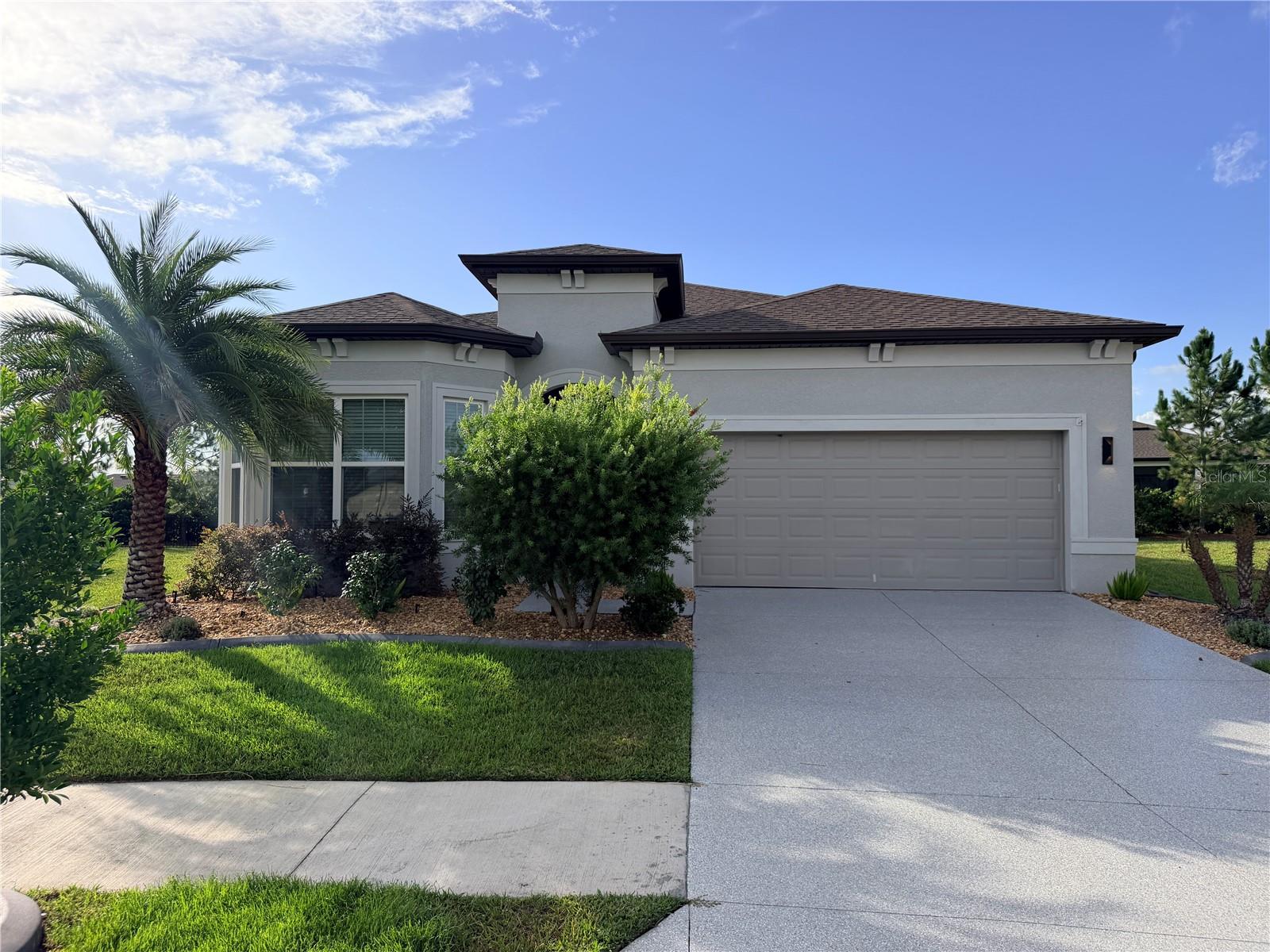 Auction Property. Auction! Bid what you want to pay.  
Modern Luxury Meets Low-Maintenance Living in Ocala!
Built in 2022, this beautifully designed 3-bedroom, 2.5-bath concrete block home offers over 2,100 square feet of thoughtfully designed living space, combining modern style, comfort, and functionality. From the moment you arrive, you'll appreciate the quality construction, spacious layout, and attached 2 car garage that make this home ideal for both everyday living and entertaining. 
Inside, you'll find an open and inviting floor plan with generous living areas, 11 foot ceilings, abundant natural light, and plenty of room for gatherings or hosting guests. The well-appointed kitchen with granite countertops, large island and two pantries flows seamlessly into the main living spaces, while the spacious bedrooms provide comfort and privacy. The primary suite offers a relaxing retreat with an en-suite shower designed for convenience and everyday luxury. The primary shower offers bench seating in an extended showering and drying area with offset controls for easy entry. As well, the primary bedroom has 2 walk in closets and a pass through for easy laundry access. The secondary bedroom has its own full bath and walk in closet as well.  The den can be used as bedroom or office and boasts double doors as well as large windows. 
Situated on a .21 acre lot, this home provides a spacious screened outdoor living space with privacy shades and a beautiful pergola on a pavered patio that's easy to maintain while still offering room to enjoy Florida's beautiful weather.  Lush curbed landscaping offers a beautiful view of plants, flowers and a robust hedge for privacy. This home features durable concrete block construction on a slab foundation, this home was built with lasting quality in mind.
Conveniently located in Stone Creek, you'll enjoy easy access to shopping, dining, medical facilities, parks, and all the recreation Central Florida has available. Experience the vibrant lifestyle of Del Webb Stone Creek, Ocala's preferred 55+ community. Whether you're teeing off on the championship 18-hole course, enjoying spa services, or dancing in the ballroom to live music, there's something for everyone. Play bocce, pickleball, tennis or softball, fish off the pier, or dine at the on-site restaurant. In this gated community, forge new friendships with like-minded individuals who share your passions, and live the way you want to live. Whether you're searching for your primary residence, a second home, or an investment opportunity, this move-in-ready property is one you won't want to miss.
Schedule your private showing today!