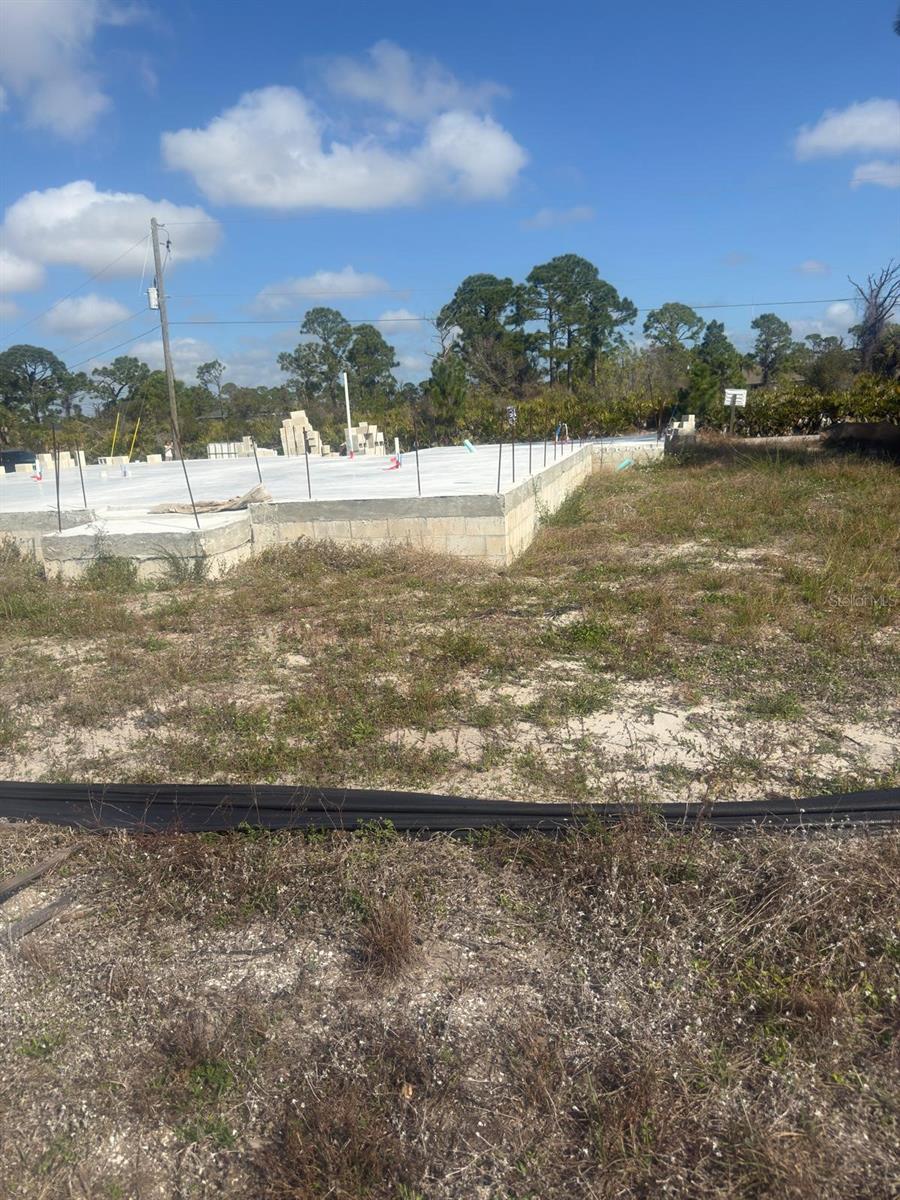 LOCATION!!! Build your dream home in an unbeatable setting. This prime lot is just minutes from beautiful beaches, golf courses, shopping, and dining. A public boat ramp with access to the Gulf of Mexico is only a few miles away, and public water and sewer connections are available. Located in the highly desirable community of Rotonda Sands, this property is surrounded by well-maintained homes and ongoing new construction. The lot is cleared, with electricity available, making it ready for your future home.
Even better significant savings already in place! The lot includes an existing slab and stem wall, helping you save time and construction costs. Approved plans are also available, allowing you to complete a thoughtfully designed home featuring 4 bedrooms, 2 bathrooms, a 2-car garage, 1,664 sq ft under air, and 2,113 total sq ft.
Enjoy a peaceful, relaxed setting while still being close to top-rated shopping, schools, beaches, and more.
Motivated seller — don’t miss this opportunity! This one won’t last!
