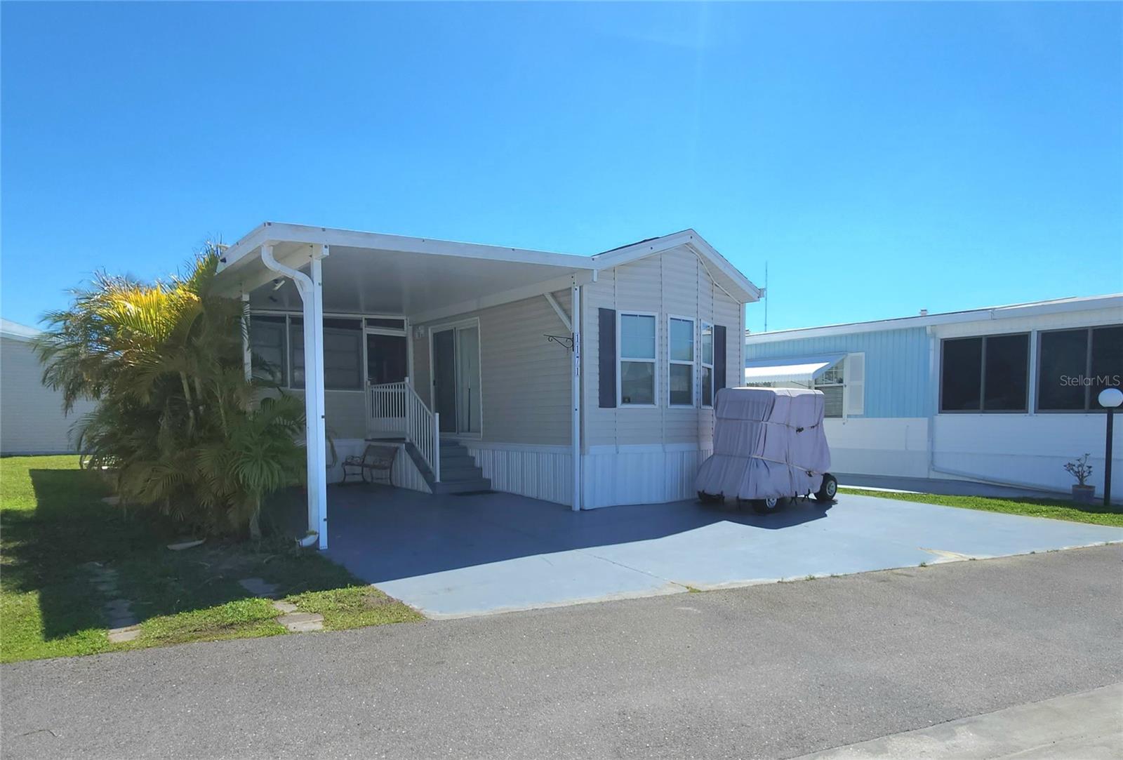 CHEERFUL, WELL-KEPT MOBILE HOME IN ACTIVE 55+ FLORIDA COMMUNITY! Don't let this little gem pass you by! One bed, one bath turnkey property with a spacious enclosed side porch and carport. Central A/C; vinyl windows; all appliances included, shed with laundry that is accessible from inside the home. GOLF CART INCLUDED. SUGAR CREEK COUNTRY CLUB has LOW HOA FEES OF $600 each QUARTER which include internet, cable, grass mowing, water, sewer and trash. There are 2 swimming pools, heated spa, clubhouse, tennis, pickleball, shuffleboard, a fitness room, and workshop. There is an active social calendar during the winter months. Enjoy this community's proximity to the River Links Golf Course and the Braden River. Sorry this is not a dog lot.