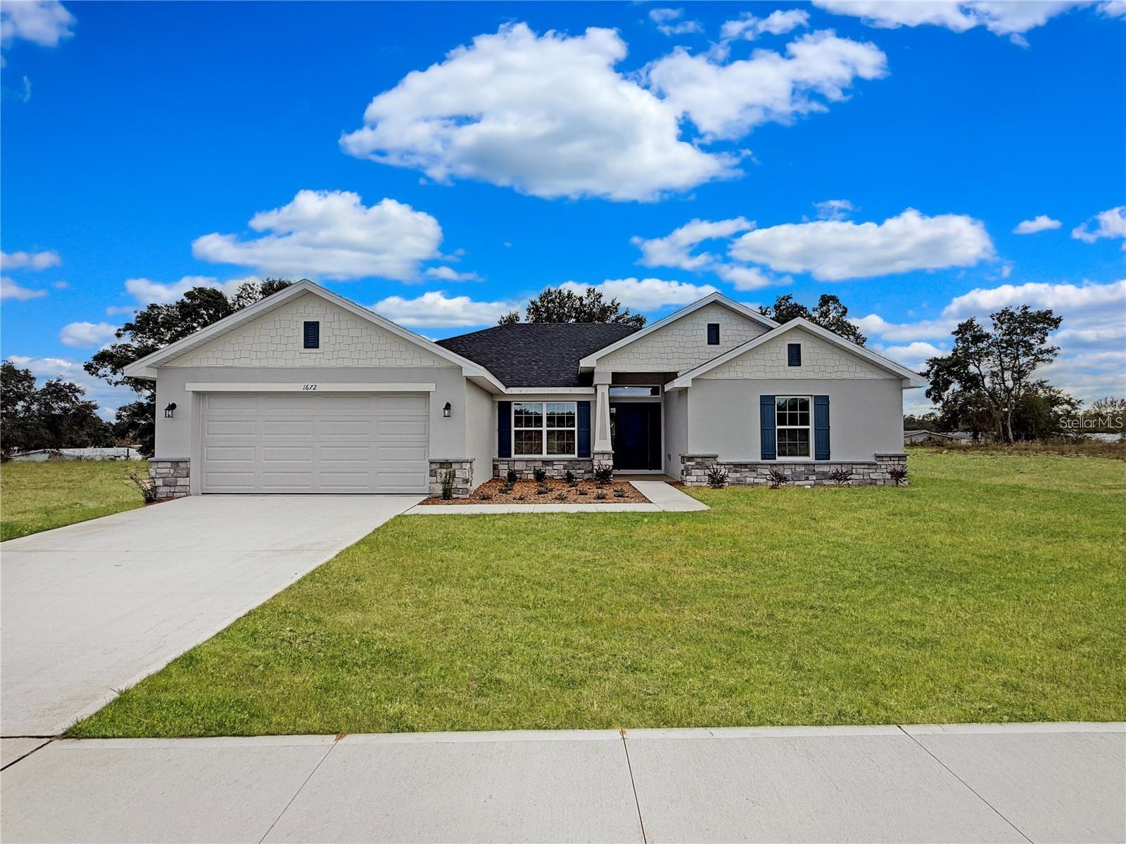 Under Construction – Welcome to the stunning 2117 floor plan in Arbor Park, Adams Homes' newest community in beautiful Leesburg, Florida! Thoughtfully designed with both style and functionality in mind, this spacious 4-bedroom, 3-bath home offers the perfect blend of modern living and everyday comfort.

This exceptional floor plan welcomes you with a grand foyer leading into an open-concept living space featuring soaring cathedral ceilings, a spacious family room, a dedicated dining area, and a beautifully designed kitchen. Complete with granite countertops, modern appliances, abundant cabinetry, and a large center island, the kitchen is ideal for entertaining and everyday living.

The private owner's suite serves as a relaxing retreat with a spacious walk-in closet and an elegant ensuite bath featuring a granite double vanity. Three additional bedrooms are thoughtfully positioned on the opposite side of the home, providing privacy for family or guests. Two of the secondary bedrooms are connected by a convenient Jack-and-Jill bathroom, making this layout ideal for growing families or multi-generational living.

Built with quality craftsmanship and attention to detail, the 2117 floor plan reflects Adams Homes' commitment to delivering exceptional value and timeless design. Homeowners will also enjoy Arbor Park's outstanding community amenities, including a resort-style swimming pool with cabana, pavilion with grilling area, playground, dog park, pickleball courts, and scenic green spaces.

Please note: This home is currently under construction. Photos are of a previously completed home featuring the same floor plan and are for illustrative purposes only. Colors, finishes, fixtures, elevations, landscaping, and design selections may vary from the home under construction.

Don't miss your opportunity to own this exceptional new home in one of Leesburg's newest communities. Contact us today for current construction updates and to schedule your private community tour!
