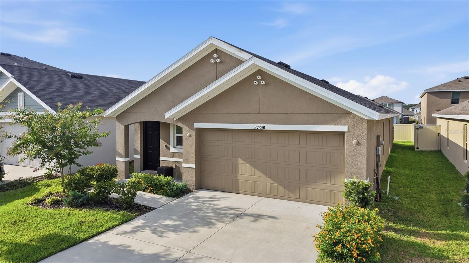 Welcome to 37396 Sharks Eye Lane, a beautifully maintained 2024-built home offering modern style, comfortable living, and a convenient Zephyrhills location. Designed with today’s lifestyle in mind, this home features an open-concept living area that seamlessly connects the kitchen, dining, and living spaces—perfect for everyday living and entertaining.

The kitchen offers sleek stone countertops and a functional layout that makes meal preparation and gatherings effortless. Step outside to enjoy the patio, providing a comfortable space for outdoor relaxation or entertaining. A two-car garage adds convenience and valuable storage.

Residents also enjoy access to the community pool and clubhouse, creating additional opportunities for recreation and relaxation. The home is also conveniently located near Hercules Park, an exciting new recreational destination offering incredible amenities for outdoor enjoyment.

Built in 2024 and offering modern construction, desirable community amenities, and a thoughtfully designed open floor plan, 37396 Sharks Eye Lane is an excellent opportunity to enjoy comfortable Florida living in a growing Zephyrhills community.
