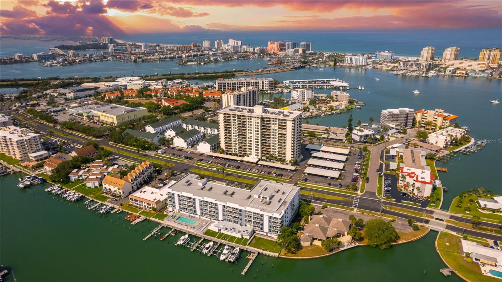 RESORT STYLE LIVING-UPDATED FULLY FURNISHED SPACIOUS CORNER CONDO - 2 BEDROOMS & 2 FULL BATHS -PLUS 2 LARGE BALCONIES- FURNISHED WITH A TROPICAL BEACH FLAIR - PLENTY OF CLOSET SPACE AND MASTER BEDROOM HAS 2 WALLS OF CLOSETS PLUS A WALK IN CLOSET-NEWLY INSTALLED COASTAL LAMINATE WIDE PLANK FLOORING- VERY LIGHT & BRIGHT CORNER UNIT -LIVING AT CLIPPER COVE HAS SO MUCH TO OFFER ITS RESIDENTS- IT HAS THE LARGEST POOL ON ISLAND ESTATES WITH A LARGE SPA WITH TIKI HUTS & TABLES & BARBECUE GRILLS - PLENTY OF LOUNGE CHAIRS -AWESOME FITNESS CENTER PLUS HIS & HER SAUNA'S -RESIDENTS ENJOY THE WATERFRONT CLUB HOUSE-VERY LARGE LAUNDRY ROOM ON THE FIRST FLOOR-A WASHER & DRYER CAN BE EASILY INSTALLED IN THE GUEST BATHROOM CLOSET- COME ENJOY LIVING ON BEAUTIFUL ISLAND ESTATES WHERE YOU ARE LITERALLY STEPS AWAY FROM PUBLIX & RESTAURANTS AND SHOPPING-JUST A SHORT BIKE RIDE TO THE BEACH- OR TAKE THE TROLLEY - THIS UNIT COMES WITH COVERED PARKING SPACE #3 & A STORAGE SPACE ON THE FIRST FLOOR- THERE IS A BIKE ROOM TO STORE YOUR BIKE ON THE FIRST FLOOR- BUILDING HAS PLENTY OF GUEST PARKING-THIS CONDO IS PERFECT FOR A PRIMARY RESIDENCE OR A 2ND HOME- YOU CAN EASILY LEASE IT OUT WHEN YOU ARE NOT USING IT- BUILDING HAS NO WAITING PERIOD TO LEASE - 3 MONTH MINIMUM- GREAT FOR OWNERS TO HELP DEFRAY CARRYING COSTS.