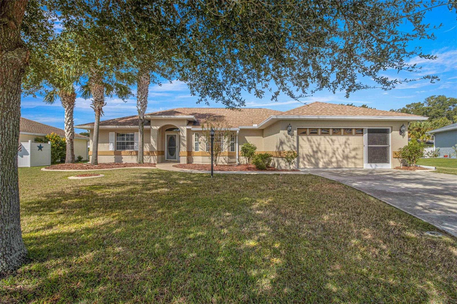 Charming three bedroom, two bath concrete block/stucco home that offers a bright and open floorplan in desirable "Marion Landing". The living, dining, kitchen are all open to each other with access to the enclosed lanai perfect for those morning coffees. The owners en-suite features walk-in closet, private bath appointed with garden tub, separate shower and mirrored vanity.. There are two guest bedrooms and guest bath close in proximity to each other. The kitchen includes a windowed breakfast nook, pantry, plenty of cabinets, prep areas, along with easy access to the laundry room and garage. You will have access to all the amenities including heated pool, fitness room, billards, 8 lane bowling alley, tennis courts and so much more not to mention a convenient SW Ocala location, Roof replaced 2020, AC replaced 2022.