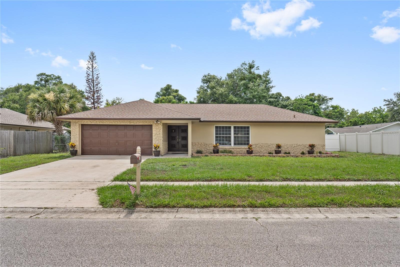 Under contract-accepting backup offers. Virtually Staged. Welcome to this move-in-ready Winter Park home, where major updates have already been completed and everyday convenience is right around the corner. Enjoy peace of mind with a new roof (2020), A/C (2021), water heater (2021), updated plumbing (2021), and an updated electrical panel. Inside, the flexible floor plan offers a living room, family room, and dedicated dining space, providing plenty of room to relax, entertain, or work from home. The main living areas feature 18" tile flooring, while all bedrooms boast upgraded luxury vinyl plank flooring. The split-bedroom layout provides added privacy for family members and guests. The kitchen is designed for both functionality and style, featuring upgraded classic cabinetry, granite countertops, a stainless steel refrigerator, a large sink, and a window overlooking the screened lanai and backyard. Additional storage includes a convenient hallway coat closet. Both bathrooms have been refreshed with updated vanities, showers, and fixtures. One of the standout features of this home is the expansive screened lanai, measuring approximately 12' x 28' and complete with an insulated ceiling, creating an inviting space that feels like an additional living area year-round. Step outside to the fully fenced backyard, where you'll find plenty of room to add a swimming pool, create a garden, or simply enjoy outdoor living.  Additional highlights include a 2-car garage, attic storage, no HOA, and zoning that allows for long-term rental opportunities. Conveniently located just around the corner from a new shopping plaza featuring Foxtail Coffee, Kelly's Homemade Ice Cream, and SoBol, this home also offers easy access to daily essentials with multiple shopping, dining, and grocery options, including Publix, within a 5-mile radius. The 417 Expressway entrance is approximately 3.5 miles away, making commuting throughout Central Florida a breeze. Enjoy all that Winter Park has to offer, with the shops, restaurants, and SunRail station of Historic Park Avenue located approximately 6 miles from your front door. This well-maintained home combines updated systems, versatile living spaces, and a prime location with no HOA restrictions—a rare opportunity in Winter Park.