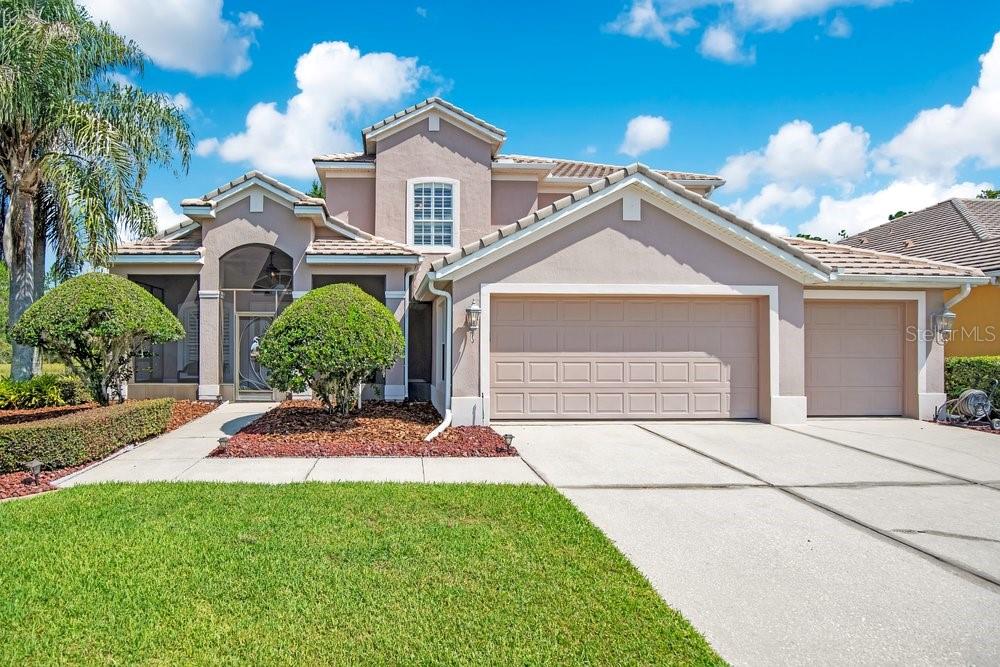 CUSTOM-BUILT and meticulously maintained by its original owner, this 4-bedroom, 4.5-bath home offers 3,445 square feet of thoughtfully designed living space on a quiet CUL-DE-SAC in the GATED Villages of Rio Pinar Golf Community.  One of the property's most distinctive features is its backyard setting. Instead of looking into another home, you'll enjoy peaceful views of PROTECTED CONSERVATION and a fishable POND, creating a level of PRIVACY that's becoming increasingly difficult to find.  Built with long-term durability in mind, the home also features a 1-INCH THICK CONCRETE TILE ROOF—not the more common clay tile that is more susceptible to cracking and chipping. In 2024, the owners invested in numerous improvements including QUARTZ KITCHEN COUNTERTOPS, a NEW SINK, new KITCHEN APPLIANCES, a WHOLE-HOUSE GENERAC GENERATOR, and a buried, OWNED 200-GALLON PROPANE TANK. Additional updates include upstairs and downstairs HVAC systems (replaced 2014 and 2017), resurfacing of the screened pool (2020), a variable-speed pool pump (2022), and updated flooring in the primary suite (2023).  The flexible floor plan offers generous living areas, a First-Floor Primary suite, High Ceilings, Solid Wood Cabinetry, a Wood-Burning Fireplace, and a three-car garage. The screened pool overlooks the water and conservation, providing a private setting for relaxing or entertaining.  Residents enjoy the security of a gated community along with amenities that include a clubhouse, community pool, tennis courts, playground, walking trails, and golf-cart-friendly streets. Golf enthusiasts will appreciate having Rio Pinar Golf nearby, while everyone benefits from convenient access to major highways, shopping, dining, downtown Orlando, Orlando International Airport, and the University of Central Florida. The sellers report that the home shares the same electrical grid serving the nearby hospital and fire station, and they have experienced very few power outages during their ownership.  If you're looking for a well-built, carefully maintained custom home with meaningful updates, exceptional privacy, and a community that offers both security and amenities, this home deserves a closer look.