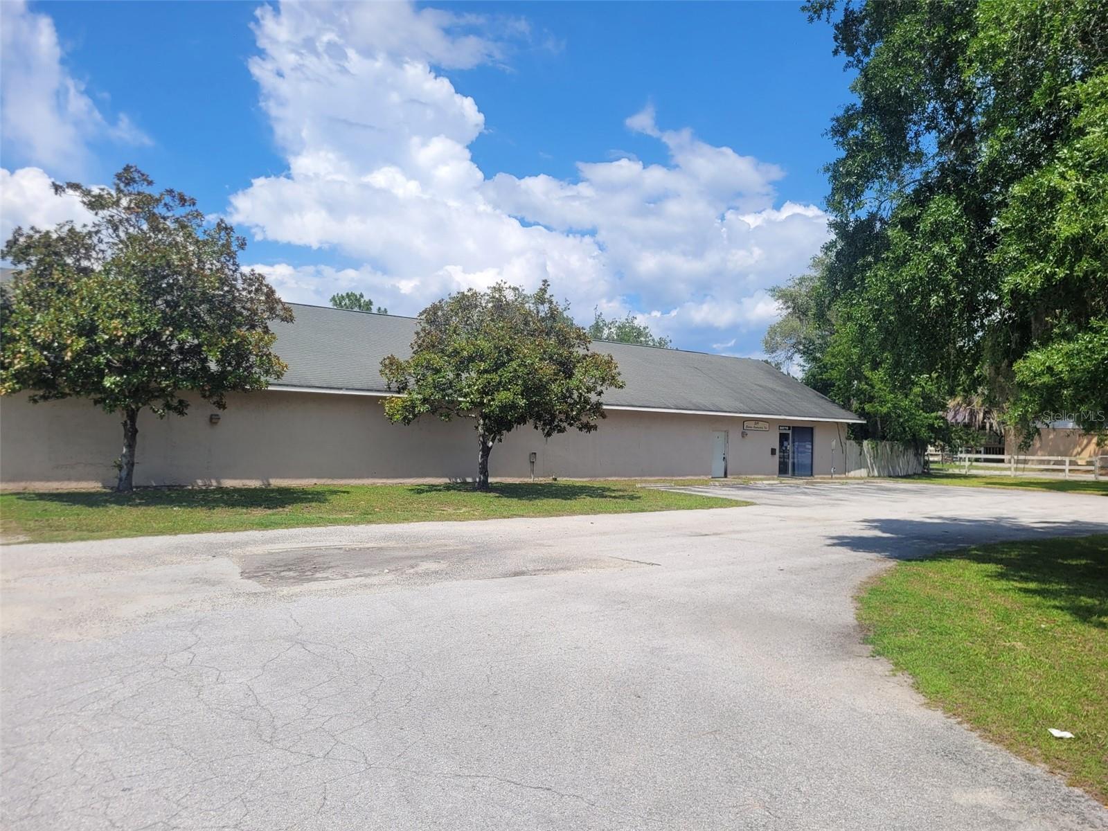Prime commercial opportunity on high-visibility CR 25! This 4,800 SF building is zoned B-2 (General Business) and offers a versatile layout perfect for owner-users or investors. Front of building features a showroom/office area, private office, and break room, plus men's and women's restrooms. Over 3,700 SF of warehouse space in the rear with roll-up door access and a separate warehouse entrance for efficient operations. 200 amp electrical service. Front parking lot with main public entrance. Excellent road frontage on CR 25 provides outstanding visibility and drive-by traffic. Centrally located with convenient access to The Villages, Ocala, Belleview, Summerfield, and Ocklawaha. Ideal for retail, office, showroom, warehouse/distribution, or a wide range of B-2 permitted uses. Don't miss this rare combination of office presence and warehouse functionality in a growing corridor.