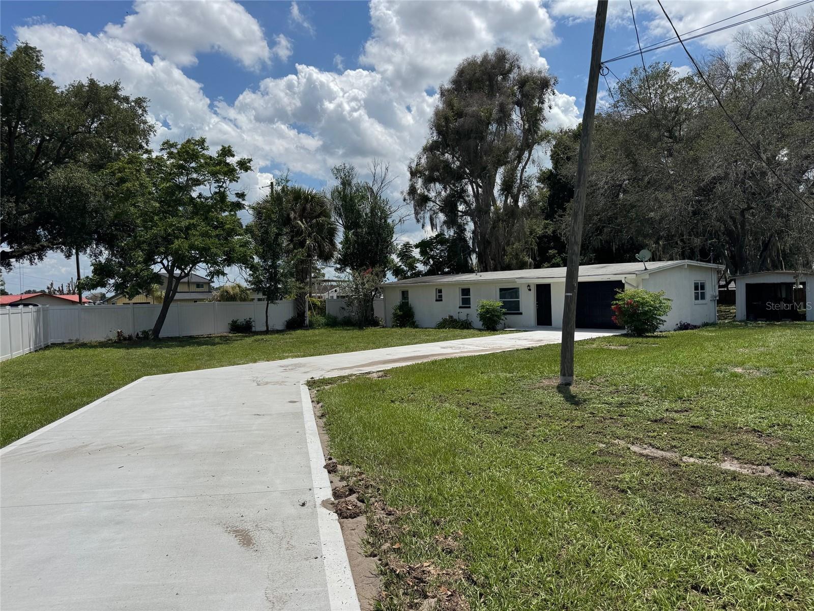 Updated 3/2 home with new flooring, driveway, windows and siding.