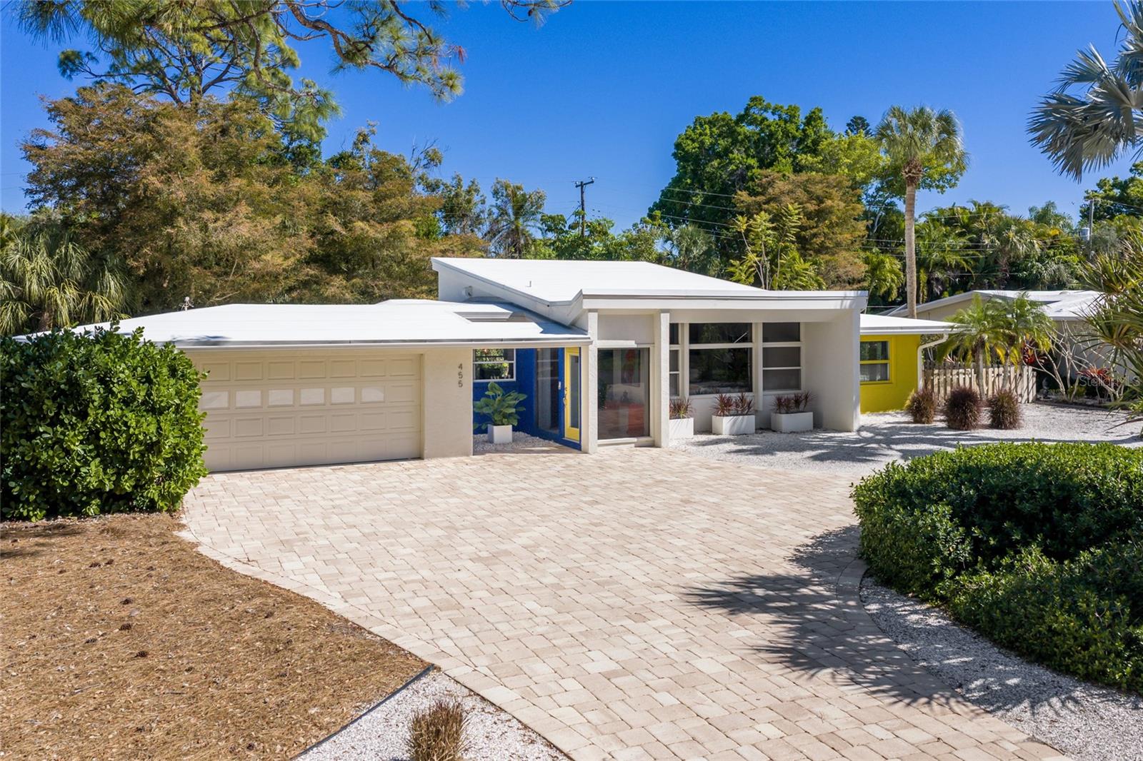 An exceptional opportunity to own a true piece of architectural history in the heart of Sarasota’s Sapphire Shores community. This classic mid-century ranch was designed by the Zimmermans - renowned members of the Sarasota School of Architecture and significantly renovated by Robert Schennum whose work traces directly back to Taliesen and the legendary Frank Lloyd Wright school.  This creates a rare pedigree that design enthusiasts and collectors will immediately recognize.  Set on an oversized lot just steps from a serene bayfront park, this three-bedroom, two-bath residence embodies timeless principles with clean lines, an abundance of natural light, long sight lines, huge picturesque windows bringing the "outside in" and thoughtful spatial flow. Every detail reflects the integrity of its original design, while the home has been meticulously maintained to preserve its character and ensure modern comfort.  Unique features include the great room with a soaring ceiling and clerestory windows, the use of grade A clear cypress for accent walls, built in, glass door cabinetry and terrazzo flooring (under carpet) with “mother of pearl” highlights which will sparkle like diamonds if you choose to refinish.  There is a spacious 2 car garage with room for a workshop and a large indoor utility room some will call “studio space” as it is currently used to house a number of original canvases painted by the previous owner.  The Florida Room opens to a beautifully landscaped and spacious backyard with a shaded gazebo perfect for al-fresco dining or simply enjoying time in the garden.  You’ll find plenty of room for a pool if you choose to add.  Sapphire Shores is adjacent to some of Sarasota’s most cherished institutions including the John and Mable Ringling Museum of Art and the Asolo Theater of Performing Arts which is home to Florida Studio Theater and the Sarasota Ballet.  Live here and you are just two miles north of downtown Sarasota, moments from world-class dining, arts, and shopping.  And just a short drive over the Ringling Bridge lands you in St. Armands Circle and the beaches of Lido and Longboat Key.  Architecturally significant homes of this caliber and condition rarely come to market. Whether you're a discerning homeowner or a collector of design, this is a legacy property that transcends trends and stands as a lasting investment in both lifestyle and history.