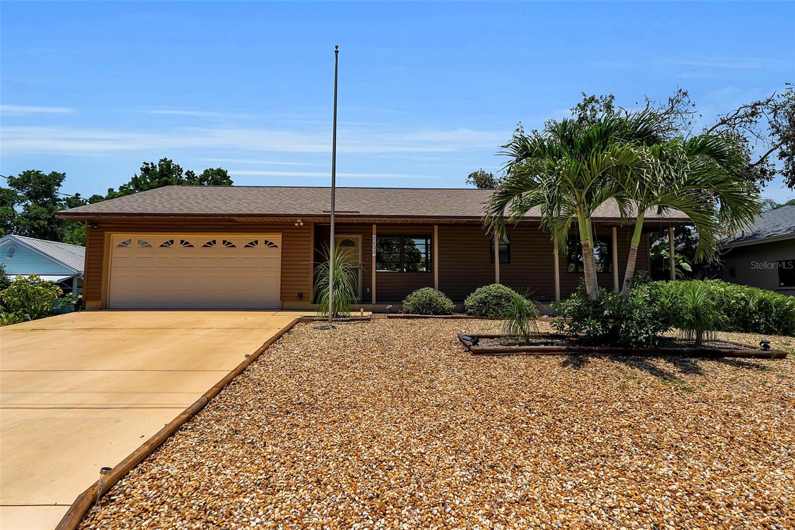 West Bradenton charm meets Florida lifestyle living in this inviting 3-bedroom, 2-bath home just minutes from Anna Maria Island, Robinson Preserve, DeSoto National Memorial, shopping, dining, and everyday conveniences. Tucked away in the established Knox subdivision with no HOA, this property offers a rare blend of character, outdoor living, and major system updates — all on an elevated lot with no history of interior flooding.

Inside, you’ll find updated flooring, fresh interior improvements, a warm wood-burning stone fireplace, and an open living/dining layout designed for comfortable everyday living and entertaining. The kitchen features freshly painted cabinetry, updated countertops, bar seating, and a convenient pass-through window to the expansive screened lanai.

The oversized screened porch truly lives like an additional living area and is the heart of the home — complete with a granite-topped entertaining bar, TV, mini fridge, and plenty of room to relax year-round. Step outside to a spacious backyard featuring tropical landscaping, a goldfish pond with waterfall, mature fruit trees including papaya, lemon, tangerine, and pomegranate, plus room to further customize or even add a pool.

Additional highlights include:

New roof (2025)
Premium HVAC system (2022)
Electrical and ductwork upgrades
Updated garage door opener
Overhauled sprinkler system
Detached workshop/storage building
City water with shallow well option
Pest control and routine maintenance history
Custom architectural plans for future primary suite expansion included with sale

Whether you’re searching for a full-time residence, seasonal escape, or a property with room to personalize over time, this cozy West Bradenton home delivers value, flexibility, and the relaxed Florida lifestyle buyers are looking for — without the burden of HOA fees.