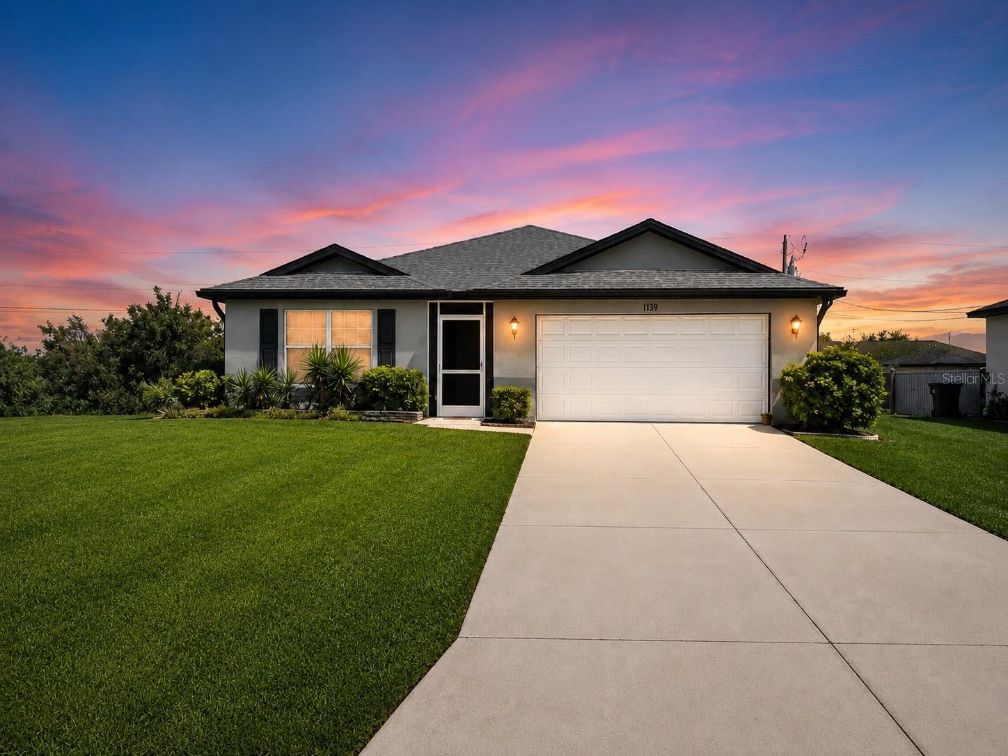 Virtually Staged. NORTH CAPE CORAL BEAUTY BUILT IN 2019 | 4 BEDROOMS | OPEN FLOOR PLAN | LOW MAINTENANCE LIVING

Welcome to this beautifully maintained 4 bedroom, 2 bathroom home located in one of North Cape Coral's fastest growing areas. Built in 2019 with durable CONCRETE BLOCK CONSTRUCTION, this move in ready home combines modern design, energy efficiency, and functional living spaces perfect for today's lifestyle.

Step inside and immediately notice the soaring CATHEDRAL CEILINGS and bright OPEN CONCEPT floor plan that create a spacious and inviting atmosphere. The heart of the home is the oversized kitchen featuring a large CENTER ISLAND, STAINLESS STEEL APPLIANCE PACKAGE, abundant cabinet space with 30" upper cabinets, and seamless flow into the dining and living areas, making entertaining effortless.

The private primary suite offers a relaxing retreat complete with a WALK IN SHOWER and generous closet space. Three additional bedrooms provide flexibility for family, guests, a home office, or hobby space.

Enjoy Florida living year round on the COVERED UNDER TRUSS LANAI overlooking the backyard, perfect for outdoor dining, morning coffee, or evening relaxation.

Additional upgrades include:

• LENNOX 14 SEER HIGH EFFICIENCY AC SYSTEM
• PGT LOW E INSULATED WINDOWS FOR ENERGY SAVINGS
• MOEN PLUMBING FIXTURES
• DIMENSIONAL SHINGLE ROOF
• WATER TREATMENT SYSTEM
• IRRIGATION SYSTEM
• 18" TILE FLOORING IN KITCHEN AND BATHS
• CONCRETE BLOCK CONSTRUCTION FOR DURABILITY AND STORM RESISTANCE

Conveniently located near shopping, dining, schools, parks, boating, fishing, golf courses, Punta Gorda, Fort Myers, Matlacha, Pine Island, and Southwest Florida beaches.

This home offers the perfect combination of modern construction, energy efficiency, and Florida lifestyle living. Schedule your private showing today before this North Cape Coral gem is gone.