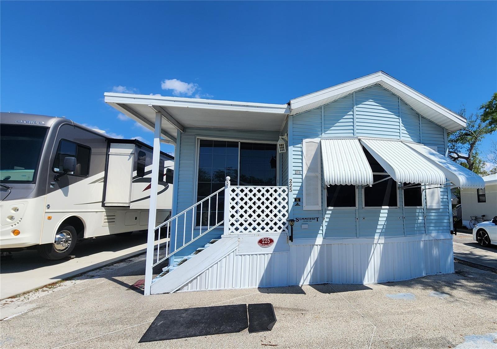 LOOKING FOR A FLORIDA GETAWAY PROPERTY? Consider this one bedroom, 1 1/2 bathroom mobile home in Sugar Creek Resort. The furnished home features a comfortable living area, eat-in kitchen, den which could be used for extra sleeping options, one-of-a-kind painted coastal murals, a huge storage closet, and it sits on Shady Oak Circle--a very social cul de sac within the community. The home has a large primary bedroom with space for a dressing room, or seating area. Central A/C replaced in 2023. Shingle portion of the roof was replaced in 2025. Newer washer & dryer. This particular lot is not in a flood zone. SUGAR CREEK RESORT has low HOA fees of just $500 each quarter which include water, sewer, trash, and grass mowing. Park amenities include heated pool, club house, tennis & shuffleboard, workshop, and many social activities during the winter season. Enjoy this home's proximity to the Braden River and River Links Golf Course. Sold in as-is condition, for CASH ONLY. Sorry this is not a dog lot.