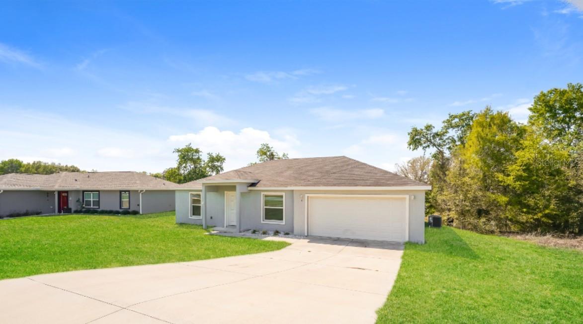 Located in the peaceful community of Citrus Springs, this beautiful home at 2656 W Castania Dr. offers modern comfort in a convenient location surrounded by Florida's natural beauty. Enjoy easy access to US-41, County Road 491, and the Suncoast Parkway, making commuting throughout Citrus County and surrounding areas simple. Shopping, restaurants, schools, golf courses, parks, and outdoor recreation are all just minutes from your doorstep.

The kitchen is designed for both function and style, featuring white cabinetry, beautiful granite countertops, stainless steel appliances, generous cabinet storage, and a convenient breakfast bar perfect for casual dining or entertaining. The open layout flows effortlessly into the spacious living and dining areas, creating a welcoming space filled with natural light.

The three well-sized bedrooms provide flexibility for families, guests, or a home office, while the thoughtfully designed bathroom offers modern finishes and everyday convenience. Whether you're relaxing after work or entertaining, this home delivers the perfect combination of comfort, style, and practicality in one of Citrus Springs' growing neighborhoods.

Bring Your Personal Touch And Make This Beautiful New Home Yours!