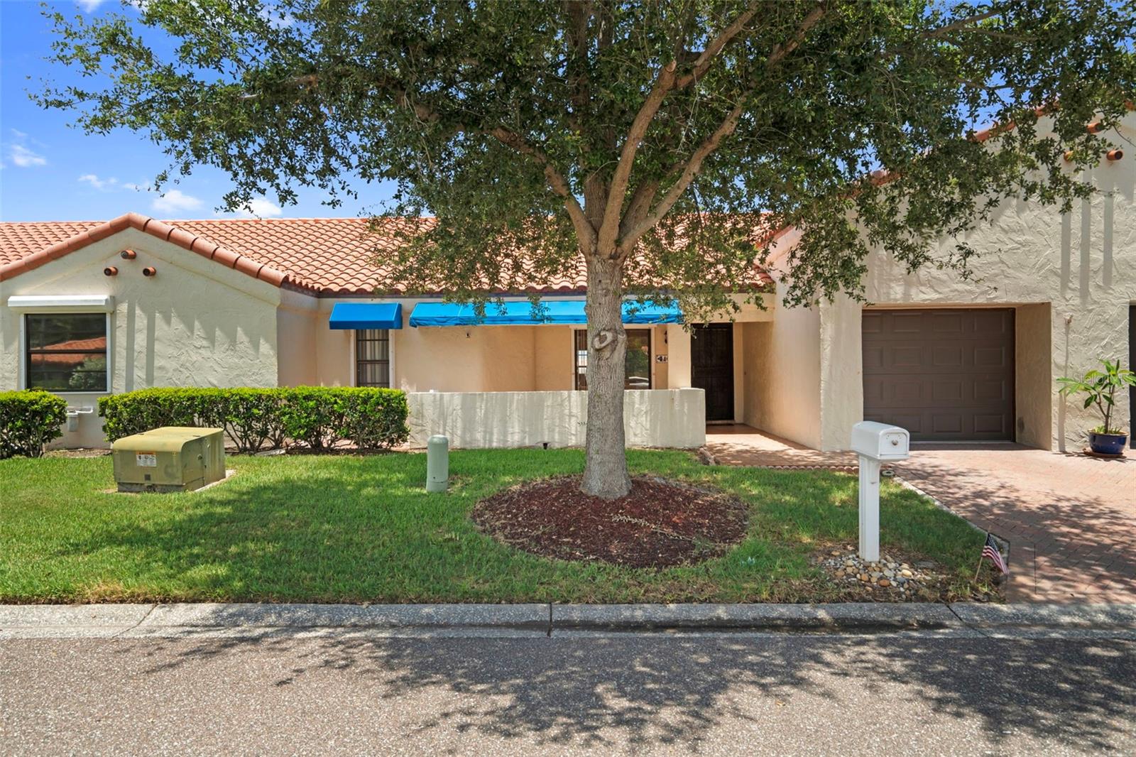 This spacious two-bedroom, two-bathroom villa is located in one of Pinellas County's highly sought-after adult communities. Before listing, the unit's interior was painted in neutral colors, and new flooring was installed in the family and primary bedrooms. This property has one of the best views in the community, with no rear neighbors and backing up to a scenic lake. Located just across from the pool and the clubhouse, all of the key amenities are just a short walk away. Since there is no through traffic, traffic remains minimal, ensuring a serene environment. Centrally located and within minutes of some of Pinellas County's finest beaches, both international airports, downtown Saint Petersburg, and Tampa. In addition to the exterior, the monthly HOA fee also includes water, basic cable, and trash.