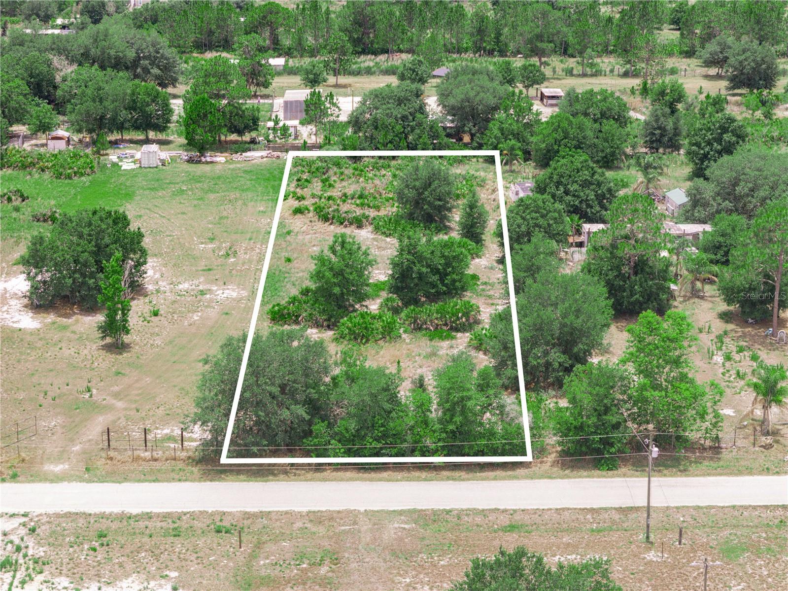 PAVED ROAD, mostly cleared of trees already! NO flood zone! This premium 1 acre  lot allows for mobile/manufactured homes. Save thousands of dollars on land clearing versus buying a fully wooded lot. For driving directions, you may use the address of the house next door, which is 10 OAKRIDGE DR FROSTPROOF, FL 33843. The property available for purchase is to the left of that address, if standing on the street facing it. You may also use copy and paste these GPS Coordinates into Google Maps or Apple maps for an exact location, just the same as you would enter a street address:  27.717667, -81.578906.