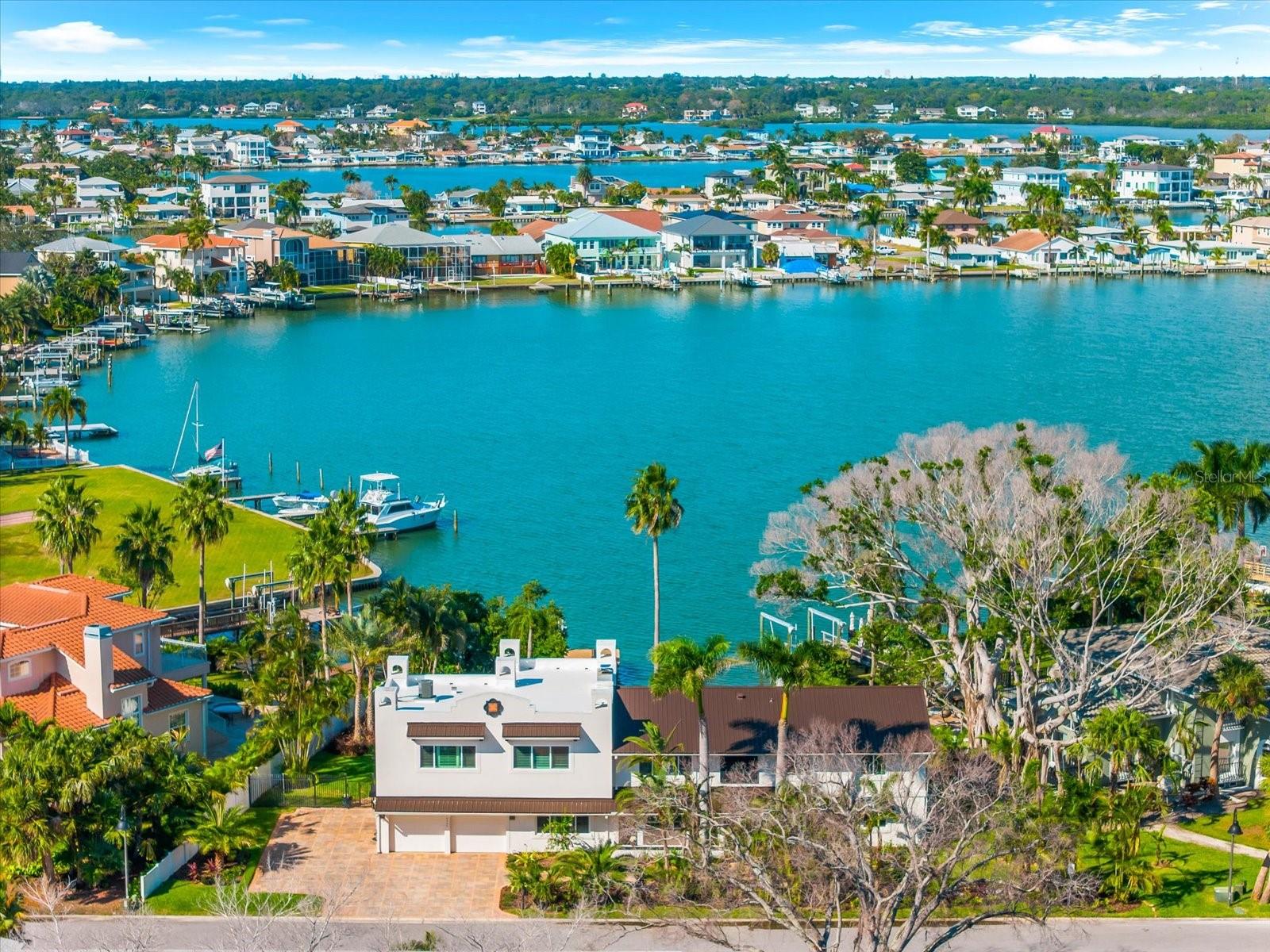 A decisive $300,000 price repositioning has transformed this North Redington Beach waterfront residence into one of the most compelling buying opportunities on the Gulf Coast.

Now offered at a dramatically improved $2.495M, this coastal waterfront estate represents a rare convergence of luxury, timing, and opportunity.

If you’ve been waiting for a waterfront home that can truly handle hosting, holidays, and multigenerational living… this is it.

With sweeping views of Boca Ciega Bay, an open-concept layout, and a chef’s kitchen featuring dual islands + dual dishwashers + wine fridge + double ovens, this home is built for connection and celebration. Every bedroom has its own en-suite bath, and the primary suite feels like a private retreat with a terrace overlooking the water—perfect for sunrise coffee.

Movie nights? Covered. A second living space off the primary suite becomes your own theatre room with a wood-burning fireplace. Outside, the fun continues with a resort-size pool, pergola, fire pit, nearly 0.4 acres of lush yard, and even a dedicated indoor dog bath.

Boaters will love the private dock + 10,000-lb boat lift, and you’re just across Gulf Blvd to white sands and Gulf beaches.
New impact windows (2024) + new metal roof (2024) add major peace of mind, along with an elevator and thoughtful upgrades throughout.

This is a rare chance to secure a luxury waterfront lifestyle with options.
