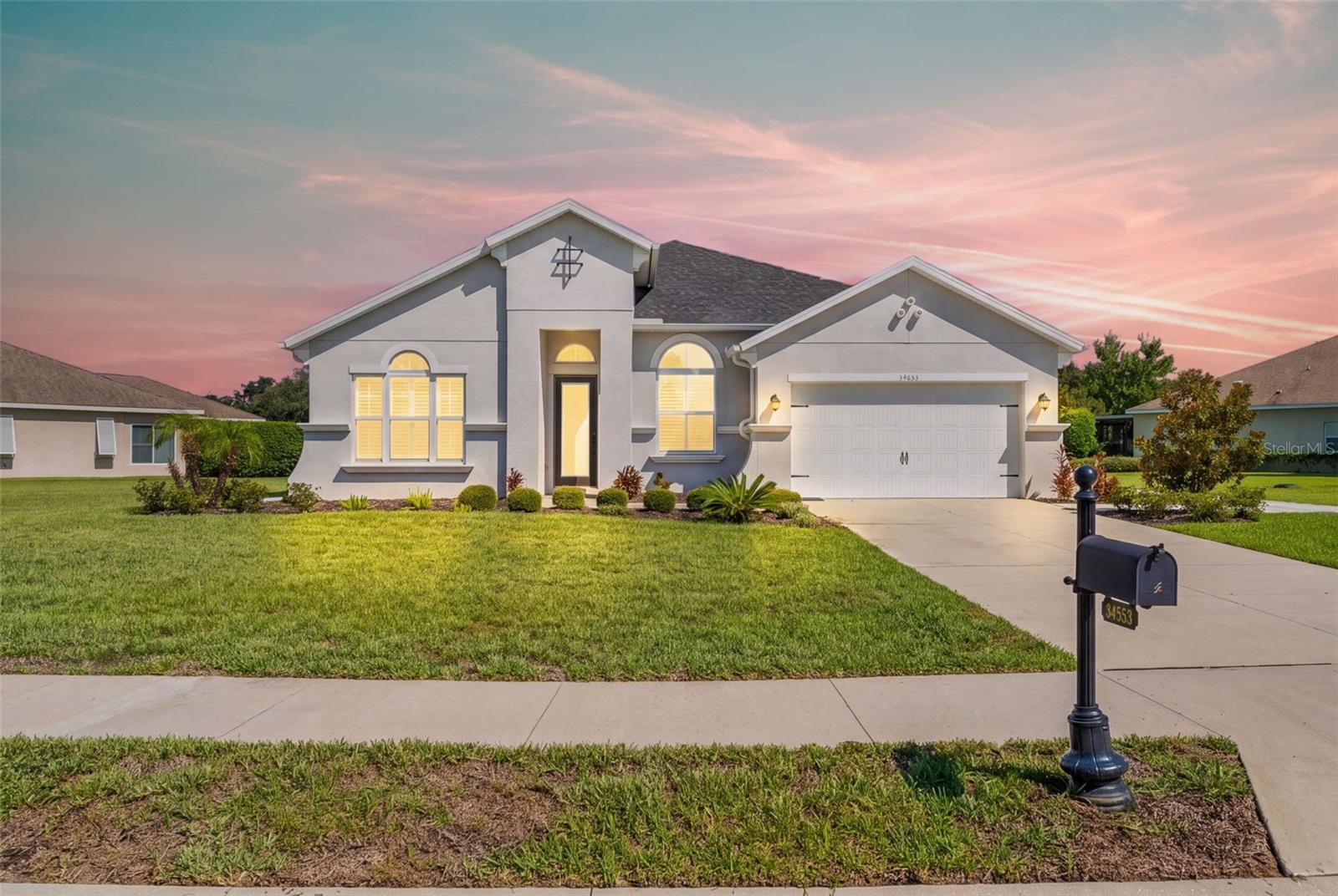 Welcome to Lake Jovita, where luxury meets functionality amid the picturesque rolling hills of Dade City.
This spacious and beautifully designed 4-bedroom, 3-bathroom, 3-car garage, pool home offers the perfect blend of comfort, functionality, and Florida living. Soaring high ceilings fill the home with natural light, creating a bright and spacious atmosphere throughout. The open and inviting layout features generous living spaces, a well-appointed kitchen that flows seamlessly into the main living and dining areas, and spacious bedrooms designed for both everyday living and entertaining. Just off the entry, a versatile bonus room provides the ideal flex space for a home office, playroom, media room, fitness area, or formal living room. Bedrooms 2 and 3 are conveniently located toward the front of the home and share a full bathroom, while Bedroom 4 is positioned toward the back with a full bathroom nearby for added privacy perfect for guests. The primary suite offers a relaxing retreat with en-suite bath with double vanity, large walk-in shower, and walk in closet.The kitchen is a chef's dream, featuring an oversized central island with quartz countertops, two-toned cabinetry and a large walk-in pantry. The Great Room overlooks the pool area and features quadruple sliding doors, making entertaining and hosting easy. From the moment you arrive, your gaze is naturally drawn to the outdoor pool area and the expansive green park space beyond. The home's quadruple sliding doors enhance the indoor-outdoor lifestyle, providing a seamless flow to the screened-in lanai, which features a pavered patio and covered seating areas ideal for entertaining.This home has all the upgrades you desire, including plantation shutters, electric bamboo shades, a built-in mudroom area, a reverse-osmosis water system, water softener,  hybrid water heater, pre-wiring for outdoor cameras, solid doors, in wall tubing for streamlined TV wiring and a brand new whole house Generac generator!  All of this on an oversized, pie shaped lot with over half an acre! Lake Jovita is a guard-gated community offering optional golf memberships, featuring two Championship 18-hole golf courses, tennis- courts, fitness center, a junior Olympic-sized swimming pool, a clubhouse with dining, a pro-shop and more! Enjoy direct access to community walking trails, a dog park, playground and sports courts from your own back yard. This home truly is a must-see- sellers are giving the new owners their brand-new golf cart for convenience to enjoy all this community has to offer! This exceptional community offers the perfect blend of elegant living, natural beauty, and a welcoming atmosphere you'll be proud to call home.