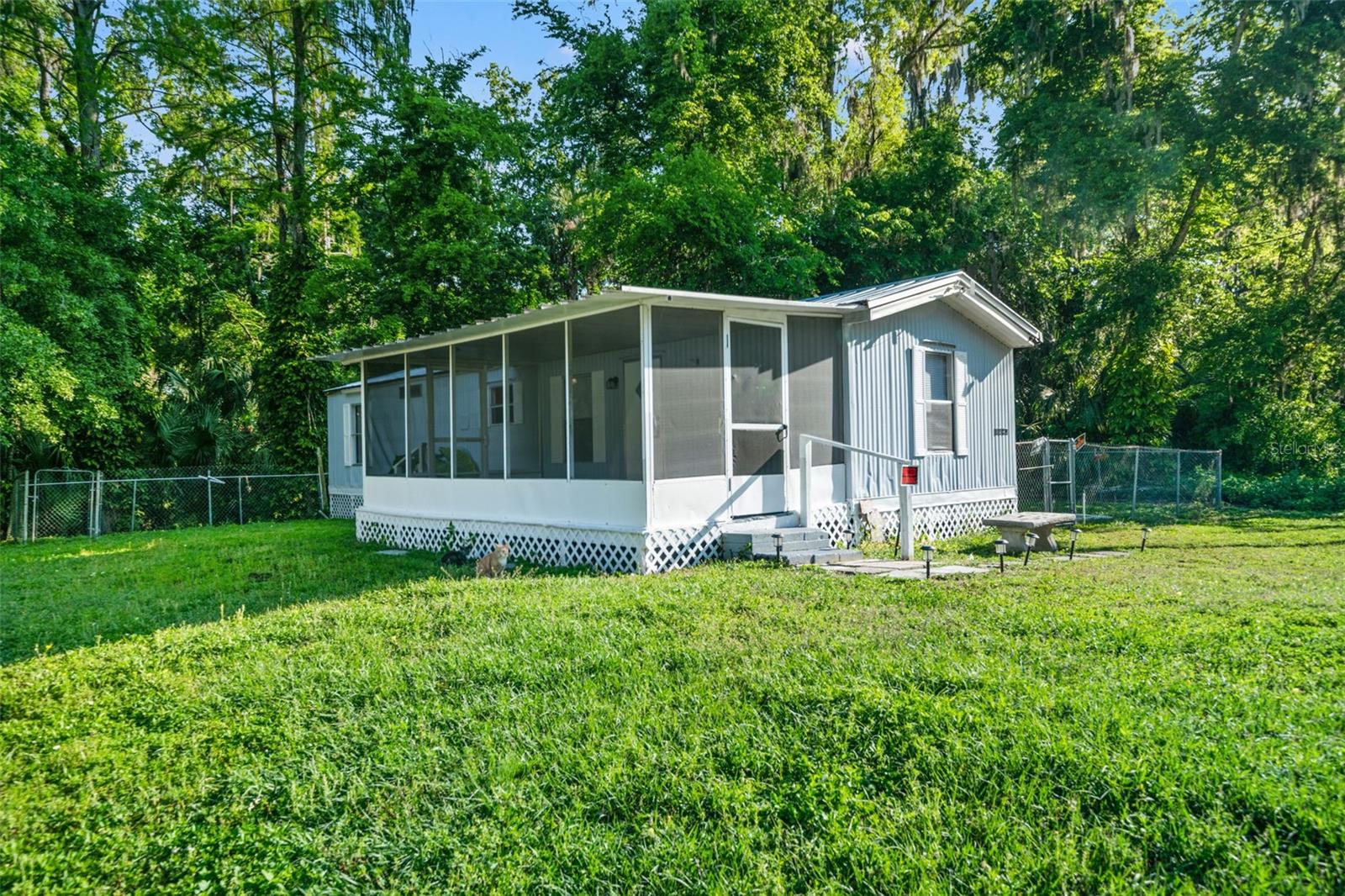 One or more photo(s) has been virtually staged. Updated 2/1 Lake Panasoffkee home with a newer metal roof. Improvements include NEW flooring, NEW fresh paint on the interior and exterior, UPDATED bathroom with tile shower, and NEW fans and lighting. This home offers covered back and front porches! Plenty of space to relax or sip a cup of coffee. Split plan with open Kitchen and Living area. Back yard is fenced and has a small storage shed. Affordable living where you OWN the land - NO HOA/NO CDD/NO FLOOD ZONE!!! Seller may consider owner financing. Located near Lake Panasoffkee, The Withlacoochee River, shopping, local restaurants, public boat ramps, golfing, and entertainment. Near I-75 and Turnpike for access to Tampa, Orland and Florida's beaches. Call today for your appointment to view!