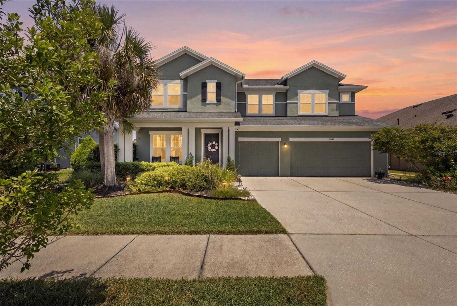 Pond views, private pool, spa, fire pit, and 3-car garage, this Asturia home delivers the indoor-outdoor living buyers are looking for! The Norchester by David Weekley Homes is one of Asturia’s most sought-after floor plans, offering 5 bedrooms, 3.5 baths, 3,624 sq ft, a loft, open office, bonus room, and generous gathering spaces throughout. Inside, the main level opens with connected dining, living, and kitchen areas designed around natural light, open sightlines, and views of the pool, patio, and pond. The kitchen features granite countertops, built-in stainless steel appliances, wine fridge, pendant lighting, abundant cabinetry, and generous prep space. A full wall of sliding glass doors anchors the living room and connects to the covered outdoor living area with tall ceiling, in-ground pool, spa, sun shelf, paver patio, fire pit, pond-view backyard, and pre-plumbing for an outdoor kitchen. Near the front of the home, the open office includes built-in cabinetry for workspace and storage. The main-level primary suite overlooks the pool and pond and features soaring ceilings, a bay window, upgraded laminate flooring, dual sinks, garden tub, walk-in shower, and large walk-in closet. Upstairs, the layout continues with a spacious loft, bonus room, secondary bedrooms, and flexible living areas that create room to spread out, entertain, work, or relax. Set near the back of Phase 1 of Asturia on a quiet street, the home offers a tucked-away setting while still keeping you close to the community amenities, trails, parks, and everyday conveniences that make Asturia so desirable.
