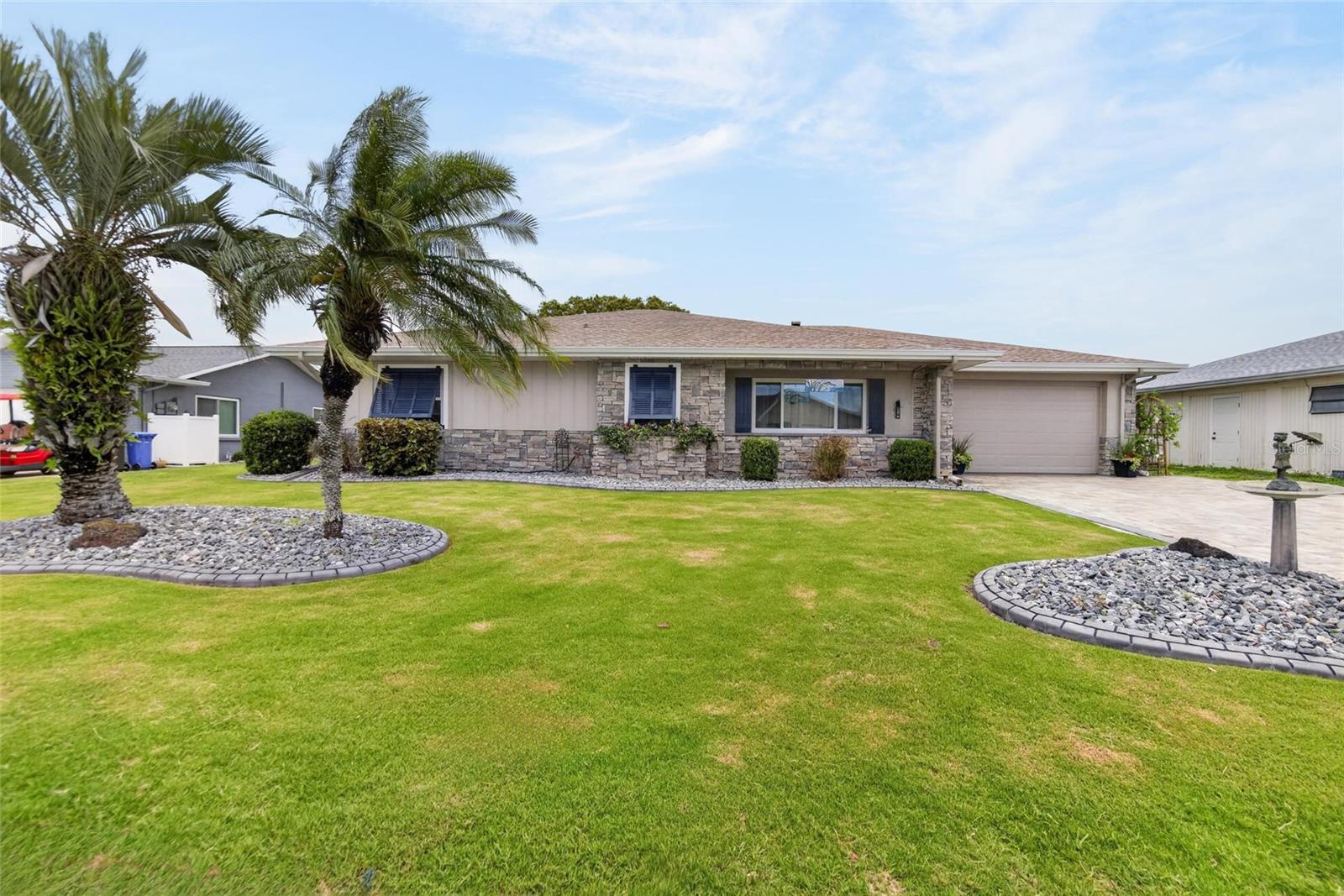 Welcome to your own private Florida paradise in Sun City Center—voted the #1 Retirement Community in America for 2024 by Realtor website and Travel + Leisure.  This beautifully updated pool home offers the perfect combination of luxury, comfort, and lake views. Overlooking scenic Lake Mirror, this move-in-ready residence has been thoughtfully upgraded inside and out, creating a home that feels like it belongs in the pages of a design magazine.  This home oozes curb appeal with fresh paint, Key West shutters, a newly resodded front yard with decorative curbing, and a paver driveway that leads to an oversized 1.5-car garage with ample storage space.  At the heart of the home is a stunning gourmet kitchen featuring soft-close cabinetry and drawers, a massive center island with gorgeous granite countertops, abundant storage on both sides, a walk-in pantry, under-cabinet lighting, designer backsplash, and premium stainless-steel appliances with a stylish range hood—perfect for everyday living and entertaining.  The bathrooms have been beautifully remodeled with modern vanities, updated fixtures, elegant tile flooring, and spacious tiled showers, creating spa-like retreats throughout the home.  Other updates include fresh paint, coffered ceilings, 5” baseboards, crown molding, roof, HVAC and ductwork, hot-water heater, double-pane windows, new pool heater, and laminate flooring.  
Step outside and enjoy the Florida lifestyle you've been dreaming of. The screened lanai opens to an expansive paver patio and sparkling pool, all overlooking peaceful Lake Mirror. Whether you're hosting friends, grilling in the outdoor BBQ area, or simply relaxing with your morning coffee, this backyard oasis offers the perfect setting. There's even a generous grassy area ideal for pets, gardening, or outdoor activities. 
Life in Sun City Center means enjoying world-class amenities just a golf cart ride away, including fitness centers, indoor and outdoor pools, pickleball, tennis, softball, arts and crafts, theater, library, woodworking, pottery, dancing, and more than 150 clubs and social activities. Optional membership opportunities are available at Club Renaissance, featuring 72 holes of golf and resort-style amenities.
Conveniently located between Tampa and Sarasota, you'll enjoy easy access to airports, shopping, dining, entertainment, healthcare, and Florida's world-famous Gulf Coast beaches.  Why just retire when you can truly live? Come discover the resort-style lifestyle, stunning lake views, and exceptional upgrades that make this home a rare Sun City Center gem.