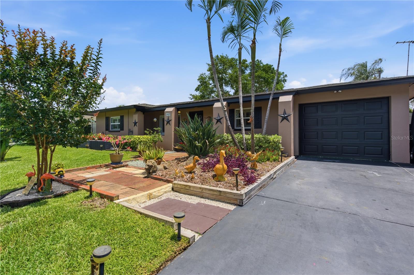 MOTIVATED SELLER...Located in the heart of highly sought-after Dunedin, this beautifully updated pool home offers the perfect blend of style, comfort, and convenience in one of Tampa Bay’s most desirable golf cart communities. Just minutes from the Gulf waters—yet situated in a non-flood Zone X and non-HOA neighborhood—this move-in ready 2-bedroom, 2-bathroom home delivers the Florida lifestyle buyers are searching for. Ideally located approximately one mile from vibrant downtown Dunedin, half a mile from the Pinellas Trail, and just moments from waterfront parks, shopping, dining, breweries, and award-winning Gulf beaches, the location truly speaks for itself. Offering 1,364 square feet of thoughtfully designed living space, the home features an inviting open layout enhanced by crown molding in the living and dining areas, updated tile flooring throughout, and an abundance of natural light. The beautifully remodeled kitchen is a standout feature, showcasing white shaker cabinetry with crown molding, stone countertops, subway tile backsplash, matching stainless steel appliances, ample storage, and a convenient bar-top seating area overlooking the versatile bonus room. Perfect as a home office, fitness space, playroom, or additional lounge area, the bonus room adds flexibility to fit a variety of lifestyles. The dining area flows seamlessly from the kitchen and opens directly to the covered, fully screened lanai, creating an effortless indoor-outdoor living experience ideal for entertaining. Step outside to your own private backyard oasis featuring a sparkling pool, lush tropical landscaping, professional landscape lighting, a fully fenced vinyl backyard, and a brand-new storage shed. Whether hosting family and friends or enjoying a peaceful evening at home, this outdoor space is designed to impress. The updated bathroom, conveniently positioned between the two bedrooms, features a beautifully tiled shower, stylish vanity, upgraded lighting, and custom barn door wall storage. Major improvements throughout the home provide peace of mind, including a brand-new air conditioning system (2026), whole-house repipe, brand-new hurricane-impact sliding glass door (2026), newer front door, deep-well irrigation system for reduced water costs, and a roof installed in September 2021. The front exterior also features customizable Govee app-controlled lighting, adding a modern touch of curb appeal day or night. Complete with a single-car garage and an oversized driveway with parking for up to four vehicles, this exceptional home combines modern upgrades, functional living space, and an unbeatable location in one of Dunedin’s most sought-after neighborhoods. Schedule your private showing today and experience everything this remarkable home has to offer. **Second bathroom and shower located in garage**