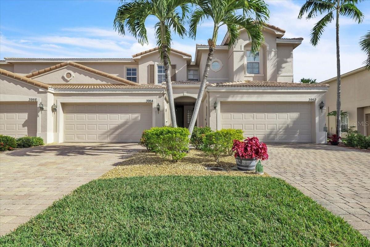 Located within the gated San Simeon community in Fort Myers, this two-story townhouse is part of a well-maintained building of seven residences and features an attached two-car garage. Offering 1,650 square feet of thoughtfully designed living space, the home includes three bedrooms and two-and-a-half bathrooms in a functional layout ideal for full-time or seasonal living. A charming covered front entry, framed by elegant Mediterranean-style architecture, welcomes you inside, while a paver driveway and walkway lead to the recessed front door and garage, providing strong curb appeal and everyday convenience. Neutral exterior tones, a classic tile roof, and manicured landscaping create a clean, upscale impression from the moment you arrive. Upon entering, the foyer opens seamlessly into the living and dining areas, all finished with tile flooring throughout the first floor for easy maintenance and a cohesive look. Sliding glass doors extend the living space to the screened lanai, which features paver flooring, offering a comfortable indoor-outdoor lifestyle. The spacious eat-in kitchen is well appointed with stainless-steel appliances, abundant cabinet and drawer storage, a pantry closet, and recessed lighting for both style and functionality. A convenient half bathroom just off the foyer, along with additional closet space, adds to the home’s thoughtful storage design. A wood staircase leads to the second floor, where the primary suite is highlighted by elegant tray ceilings, an expansive walk-in closet, and a spa-like bathroom with a soaking tub, walk-in shower, dual single-sink vanities, and a private toilet room. Two generously sized guest bedrooms, each with built-in closets, share a full bathroom. Wood-look tile flooring extends throughout the second floor, combining style and durability, and a conveniently located laundry room completes the upper level. Impact-resistant windows provide added peace of mind throughout the home. A new roof, installed in 2024, enhances both protection and value, while residents enjoy resort-style amenities including a fully equipped fitness center, sparkling swimming pool and spa, children’s play area, and clubhouse. This thoughtfully maintained residence blends comfort, style, and convenience in one exceptional package. Centrally located, the home offers easy access to major shopping centers, restaurants, Southwest Florida International Airport, parks, and I-75, combining convenience with a vibrant Fort Myers lifestyle. **PLEASE ENJOY THE 3D INTERACTIVE VIRTUAL TOUR ASSOCIATED WITH THIS LISTING**