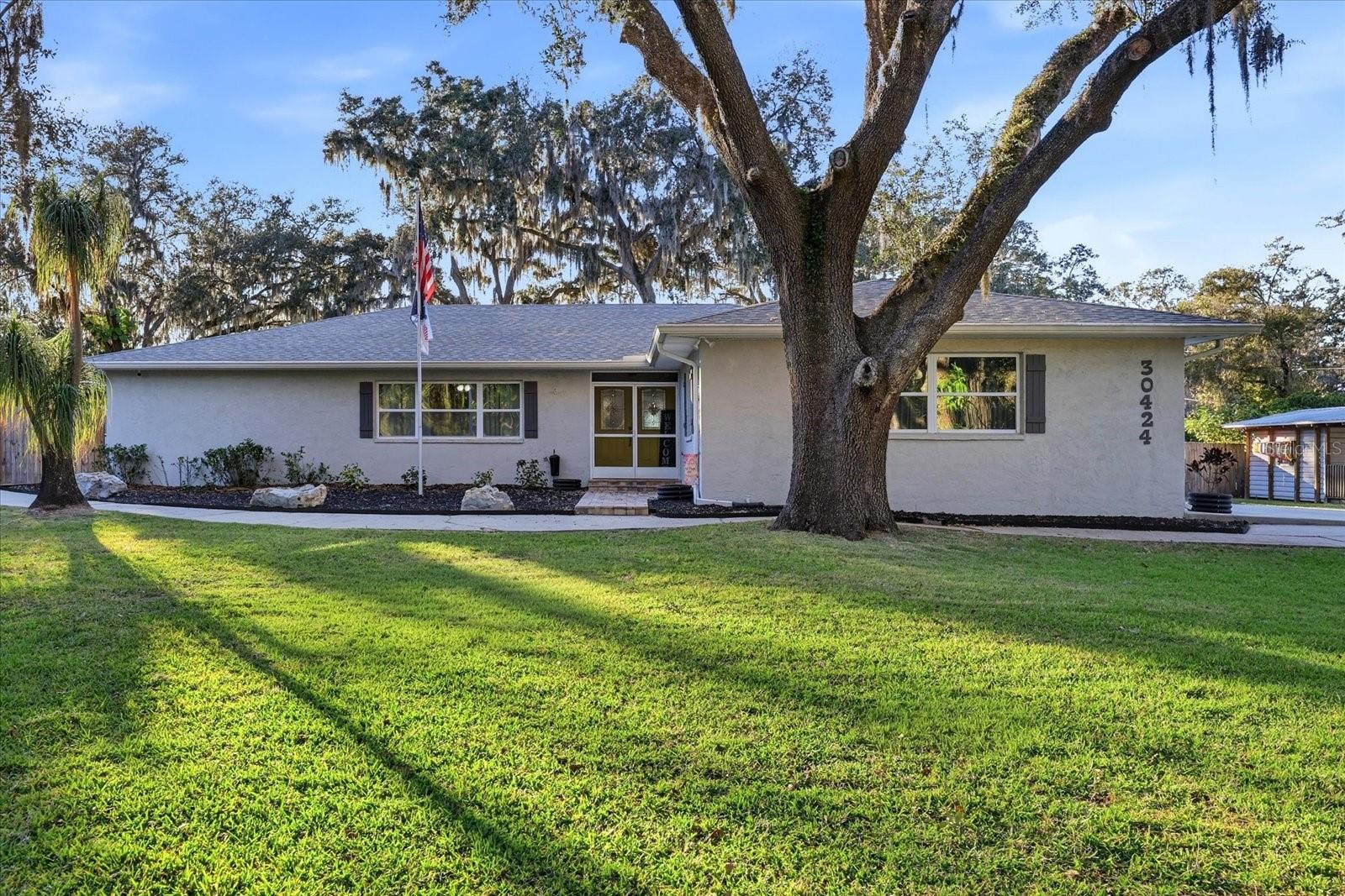 Experience Lakeside Luxury Living! *** Property being sold with Parcel #20-25-28-0010-F2300-0012/MLS#TB8481504; both properties are priced seperatly. Will consider selling seperately*** Welcome to your private retreat on the tranquil shores of Lake Holdon, with breathtaking sunsets, refined finishes, and resort-style amenities come together in perfect harmony. This impeccably renovated 4-bedroom, 3-bath residence offers an elevated living experience with a heated pool, expansive oversized lanai, and serene water views that set the tone for effortless indoor-outdoor living. Step inside to discover a home transformed through nearly a decade of thoughtful, high-quality upgrades. From impact-resistant windows and French doors to quartz countertops, custom cabinetry, and a spa-inspired primary suite, every detail has been curated for comfort, beauty, and peace of mind. Major structural improvements — including a new roof (2025), updated HVAC systems, a tankless water heater, spray-foam insulation, well motor & bladder (2026), and a comprehensive water filtration system — ensure long-term value and efficiency. Outdoors, the luxury continues. Enjoy a resurfaced pool, an extended lanai, new pavers, and a re-screened no-see-um enclosure, all designed for year-round relaxation and entertaining. The property is further enhanced with a Sentricon termite system, security cameras, and a recent septic inspection for added confidence. Perfectly positioned just 1 mile from the new Johns Hopkins Children’s Hospital – Wesley Chapel, and moments from the Epperson Lagoon, Tampa Premium Outlets, Wiregrass Mall, The Krates, Costco, Target, and an array of upscale dining and shopping, this home offers both serenity and convenience. A rare opportunity to own a beautifully modernized lakeside sanctuary in one of Wesley Chapel’s most desirable locations. Ower will consider financing the sale of both parcels with the following terms: $600,000 down, balance at 10% interest w/ a 10 yr balloon. Listing agent is the property owner.