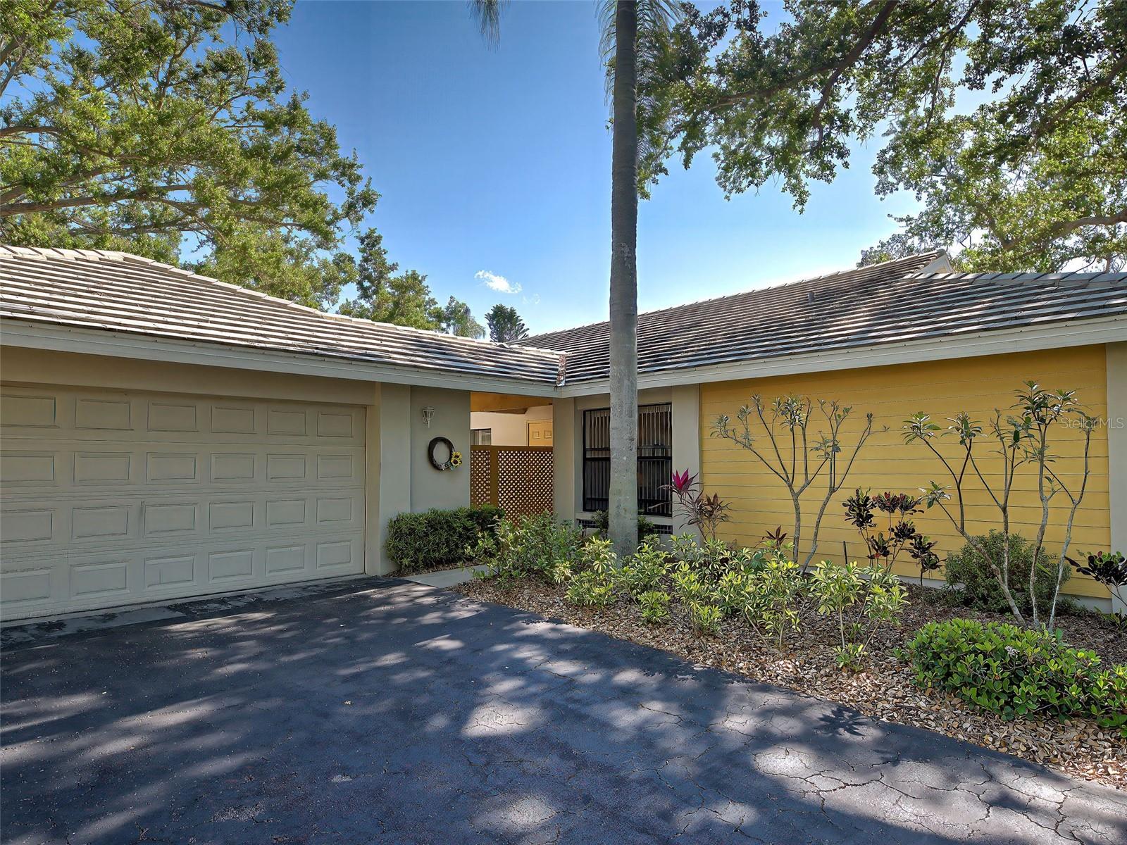 Welcome to your very own "SLICE OF PARADISE" where stunning water views and effortless living come together in the highly sought-after community of Myrtle Trace at the Plantation.  This vibrant two bedroom, two bath Villa is more than just a home - it's a lifestyle. Nestled amongst streets lined with majestic oak trees and charming brick roundabouts; this Villa gives the picture-perfect, tucked away feel YOU WILL LOVE!  You are Walking distance to the Welcoming Community Clubhouse and Heated Pool where year round activities and social events abound - where neighbors truly become friends. Wake up to peaceful lakefront scenery and sip your morning java on the lanai as herons and egrets glide by. The screened lanai can be accessed from either the Breakfast Nook or the Main Living Area.  Vaulted ceilings and skylights flood the home with warmth and natural light. The Open, Airy Main Living Area boasts vaulted ceilings as does the connecting Dining Room. From the Main Living area you have enormous windows that reflect the sun and spectacular views of the water.  The spacious owner's suite is a true retreat with tranquil water views and an updated ensuite featuring tall cabinets and a walk in shower.  Of SPECIAL NOTE is the Completely NEW AC System Installed September 2025, BRAND NEW ROOF November 2025 (being put on now) Provides You With Total PEACE OF MIND!  All this and being sold TURN KEY. JUST PACK YOUR BAGS AND MOVE IN.  When you're ready to explore, you are only minutes to the Charming, Historic Downtown Venice that has an abundance of boutiques, gourmet or casual restaurants and outdoor bistros; AND BE SURE TO BRING YOUR FUR BABIES ALONG AS MOST OUTDOOR RESTAURANTS LOVE THEM.  Our beaches are minutes away and there are several to choose from.  The up and coming Wellen Park and Cool Today Stadium is nearby where the Atlanta Braves Spring Training games are held. Here you can enjoy outdoor concerts, entertainment, shopping and dining.  Costco, Medical Services, and major Highways are all nearby as well. An optional membership to the Private Country Club offers additional amenities and activities for your enjoyment. The Prestigious Plantation Golf & Country Club boasts various activities and features a heated community pool, two 18 hole Championship Golf Courses, a fitness Center, tennis courts, heated Jr. Olympic size pool -- this is the place for you!  This property presents an ideal opportunity for comfortable living and leisure. Don't miss THIS RARE OPPORTUNITY!  Everything you will ever need or want is at your fingertips, Call or Text Today For Your Private Showing.