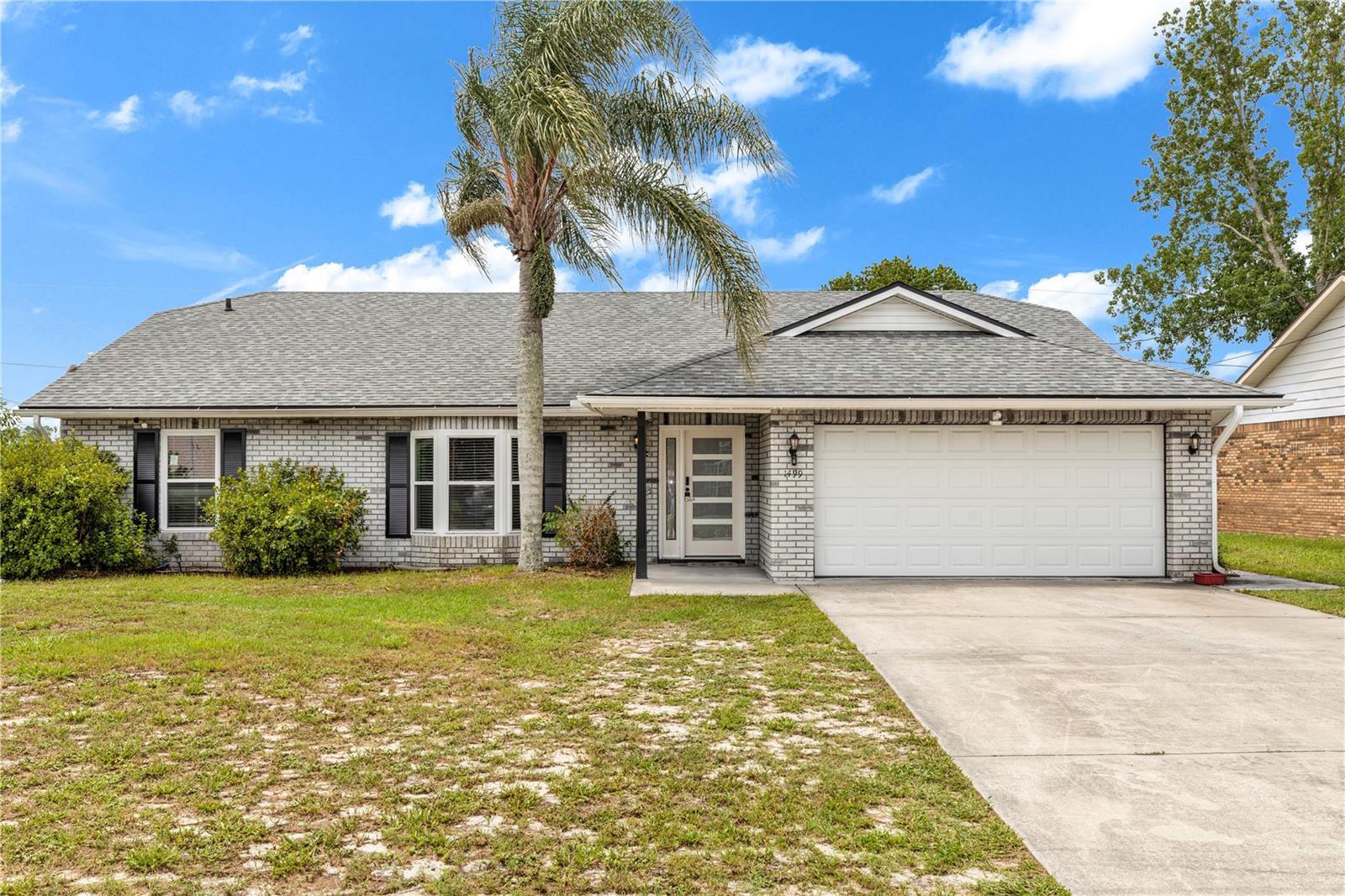 Dreams Do Come True with this beautifully maintained 3-bedroom, 2-bath pool home offering nearly 1,800 square feet of living space on an oversized 10,000+ square foot sweeping corner lot! This property combines spacious indoor living with the Florida outdoor lifestyle buyers are searching for. Major updates have already been completed, including a new roof in 2023, updated kitchen in 2018, drainfield replacement in 2016, and a beautifully remodeled master bathroom in 2023. From the moment you enter, you'll be drawn to the unique sunken formal living room that adds character, architectural interest, and an inviting space for gathering with family and friends. The home then opens into a comfortable sitting area that flows seamlessly into the kitchen and family room, creating an ideal layout for everyday living and entertaining. The spacious master suite features direct access to the pool area through sliding glass doors and a beautifully updated master bath. A split bedroom floor plan offers privacy and flexibility for family members and guests.The updated kitchen showcases granite countertops, stainless steel appliances, and abundant cabinet space, making it both beautiful and functional. Sliding glass doors from the family room lead to the covered lanai and sparkling screened pool, creating the perfect extension of your living space outdoors.
Step into your backyard oasis featuring a large fenced yard with plenty of room to play, entertain, or simply relax by the pool. Enjoy cool evenings around the firepit area. Brring all your toys! Double gate access provides ample room for RV, boat, trailer, or recreational vehicle storage storage shed. Conveniently located close to shopping, dining, schools, parks, and major roadways, this home offers a fantastic opportunity to own a spacious pool home with significant updates already in place and endless possibilities to make it your own.
