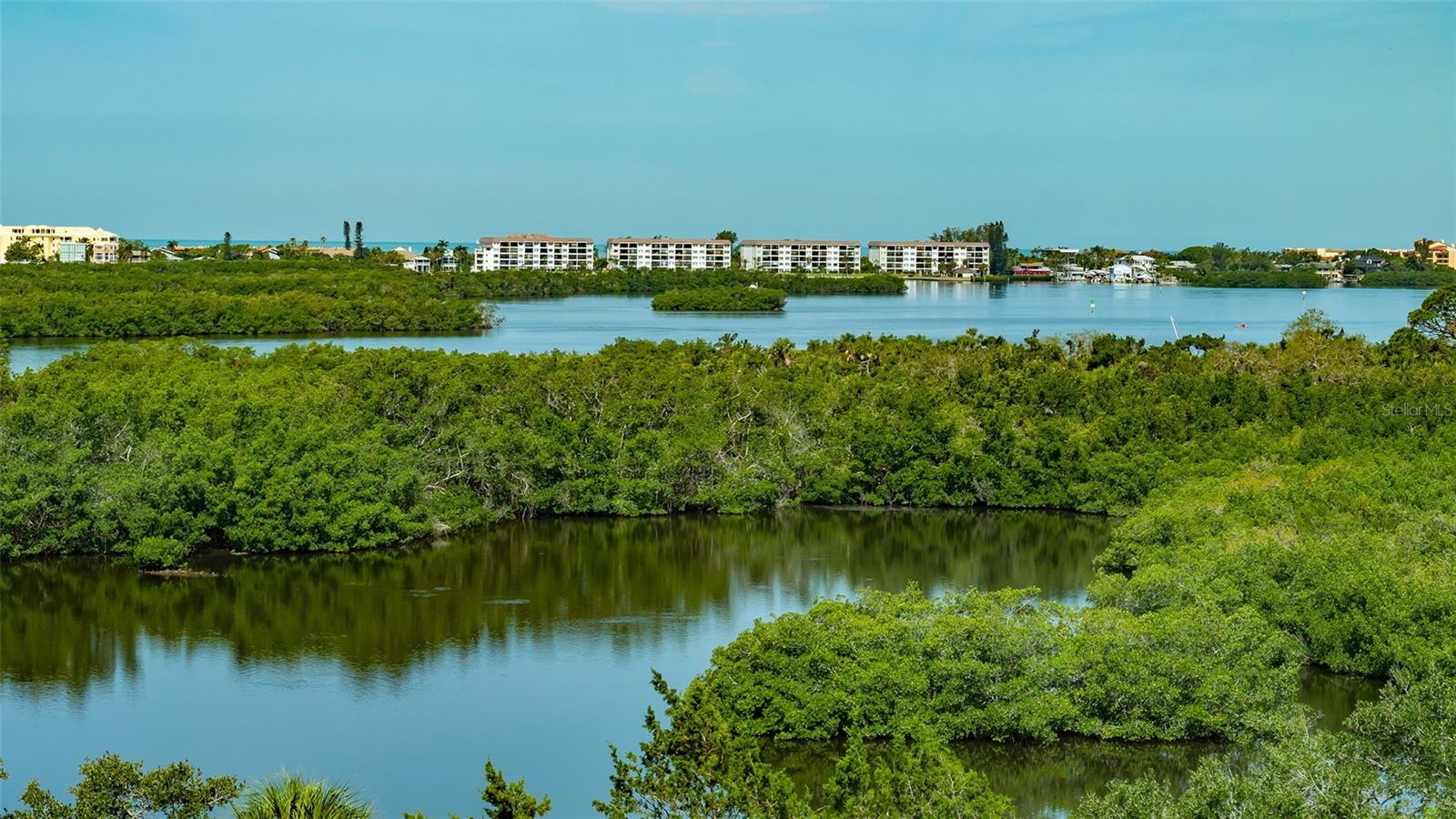 Virtually Staged. This incredible offering has everything you need to live a luxury condominium lifestyle in comfort and ease; 3 bedrooms, 3 full baths, a formal dining room and a 2ND FLOOR PRIVATE 2 CAR GARAGE! Add to this, gorgeous views from almost every room, and you have found a well-priced gem in Meridian at The Oaks Preserve to enjoy all the Gulf Coast has to offer. Take the private elevator to the sixth floor and explore this spacious unit. The great room has high ceilings and sliding doors to the large, screened balcony that offers gorgeous water views in the day, and breath-taking sunsets in the evening. The open kitchen features a pantry, stainless steel appliances and a breakfast bar.  The adjoining dining room gives you room to host formal meals. The master suite has a door that opens to the balcony, two walk-in closets and an en-suite master bath with soaking tub, a walk-in shower, a good number of cabinets, mirrors and counter space.  The 2nd bedroom is en-suite, and the third is currently being used as an office.  A nice option for those who want to work at home. Want to get outside and enjoy the Florida sunshine?  You can walk to the Meridian residents-only pool and spa. Here you will also find an outdoor kitchen and workout room. As members of The Oaks Club, you also can take advantage of all it offers, two 18-hole championship golf courses, 12 HAR-TRU tennis courts maintained to tournament standards, four of which are lighted, bocce and pickle ball courts, a junior Olympic community pool, and a wide variety of dining, recreational and social offerings.  Membership is required with homeownership. There is currently no waiting list for either Golf or Sports/Social membership.