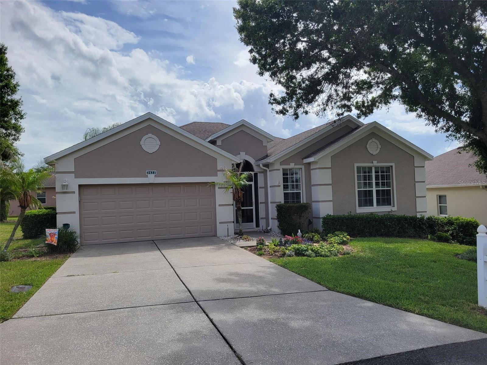 Come see this Beautiful and Well-Maintained Golf Front Home in the Highgate Community of Sought-After 55+ Kings Ridge. This is the Large St James Floorplan Home featuring 2031 Square Feet includes 3 Bedrooms, 2 Baths and Large Great Room that Overlooks the 2nd Green on the Ridge Golf Course.  Walk up to the Home through the Screened Enclosed Covered Entry to the Stained Glass with Side Panel Front Door.  Upon entering the Foyer, notice the Beautiful Chandelier Entry Light and Inlayed Tile Mosaic on the Floor.  Large Ceramic Tile with Inlays throughout the Interior with Luxury Vinyl Plank Floors in the Bedrooms.  No Carpet. The Kitchen and Bathrooms have been Recently Fully Renovated.  The Kitchen has new Stainless Appliances and Sink, New Range Hood, Quartz Countertops, Tile Backsplash and 42-inch Cabinets with New Hardware. The Bathrooms have also been Renovated with New Fixtures, Toilets and Walk in Shower in the Master Bathroom.  Enjoy Sunsets on the West Facing Covered Screened Lania that Overlooks the 2nd Green of the Ridge Golf Course.  There is also a Pavered Patio for your Grilling and Sun-Bathing Pleasure. The Home Exterior was Painted in 2024, Roof replaced in 2015, AC in 2014 and new Water Heater in 2025.  Home has Ceiling fans in the Living Room and all Bedrooms for Cooling Comfort. There is a 2 Car Garage with Door Opener and Laundry Room with Washer and Dryer. Enjoy the Safety of a Guard Gated Community and Beauty of Tree-Lined Streets and Amazing Community Amenities including a Multi-Million-Dollar Royal Clubhouse. Live the Royal lifestyle with two 18-Hole Golf courses, Three Heated pools, Two Fitness Centers, Spas, Tennis & Pickleball Courts, Billiards, Shuffleboard, Shows, Bingo, Dancing, Cards, Crafts, Movie & Food Truck Nights and Join any one of the Many Clubs Galore. HOA dues include Lawn Maintenance & Irrigation, Exterior Painting, Landline Phone, Basic Cable and Internet and all Community Amenities. Close to Highway 27 and 50, Florida Turnpike with easy access to Downtown Orlando within 30 minutes & twenty-two miles to Disney. Conveniently Located Outside the Community: Golf Cart Accessible Publix, University of Florida Urgent Care Center, Doctors, Dentists, Walgreen’s Pharmacy, Quest and close to Costco, Kohls, Walmart, Target, BJs and Numerous Restaurants within five miles. At least one buyer must be at least 55 years old or older for HOA approval and pay a one-time $542 Capital Contribution to the Highgate HOA at closing. Call for a private tour of this fantastic home.