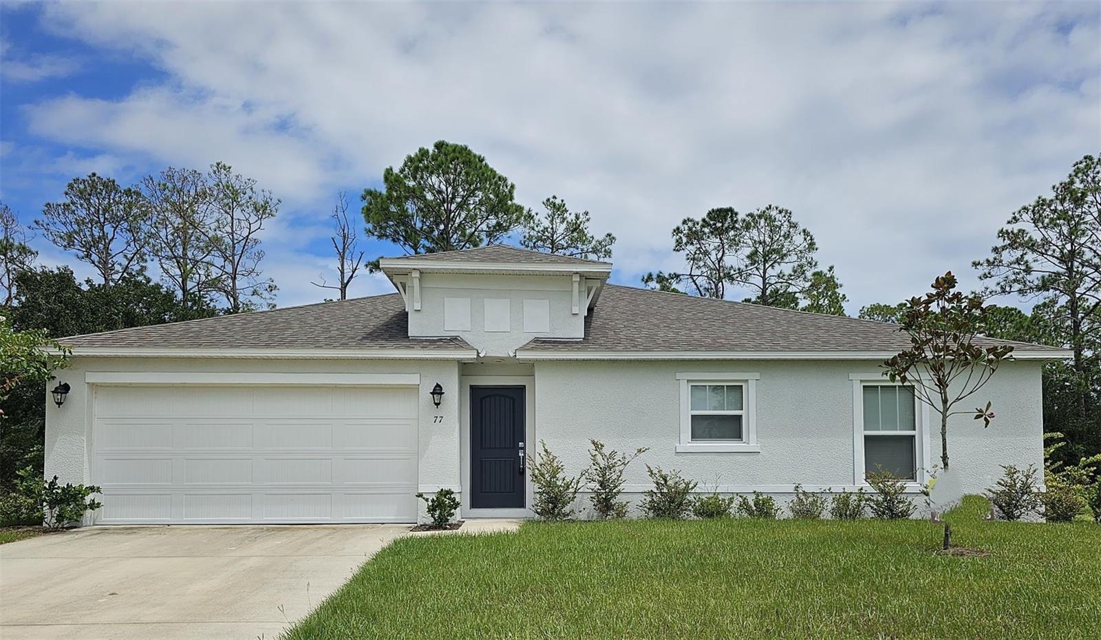 One or more photo(s) has been virtually staged. ***1ST MONTHS RENT FREE *** Welcome to this beautiful home, located in the charming city of Palm Coast, FL. This spacious home offers a comfortable and inviting atmosphere for you to call your own. With three bedrooms and two bathrooms, there is plenty of space for you to relax and unwind. The kitchen is equipped with sleek stainless steel appliances, perfect for preparing delicious meals for yourself and loved ones. The solid surface countertops not only add a touch of elegance but also provide ample space for all your culinary needs. The vaulted ceilings create an open and airy feel throughout the home, allowing natural light to flood in and brighten up your living space. You'll appreciate the convenience of window treatments, providing privacy and shade when desired. We understand that your furry friends are an important part of your family, which is why this home is pet-friendly. Enjoy the freedom of having a backyard where your pets can roam and play. Whether you're looking to explore the beautiful beaches, indulge in local dining options, or take advantage of the various recreational activities, Palm Coast has something for everyone. Don't miss out on the opportunity to make this beautiful 3/2 home your own. Contact us today to schedule a tour and experience the charm and comfort that awaits you in Palm Coast, FL.