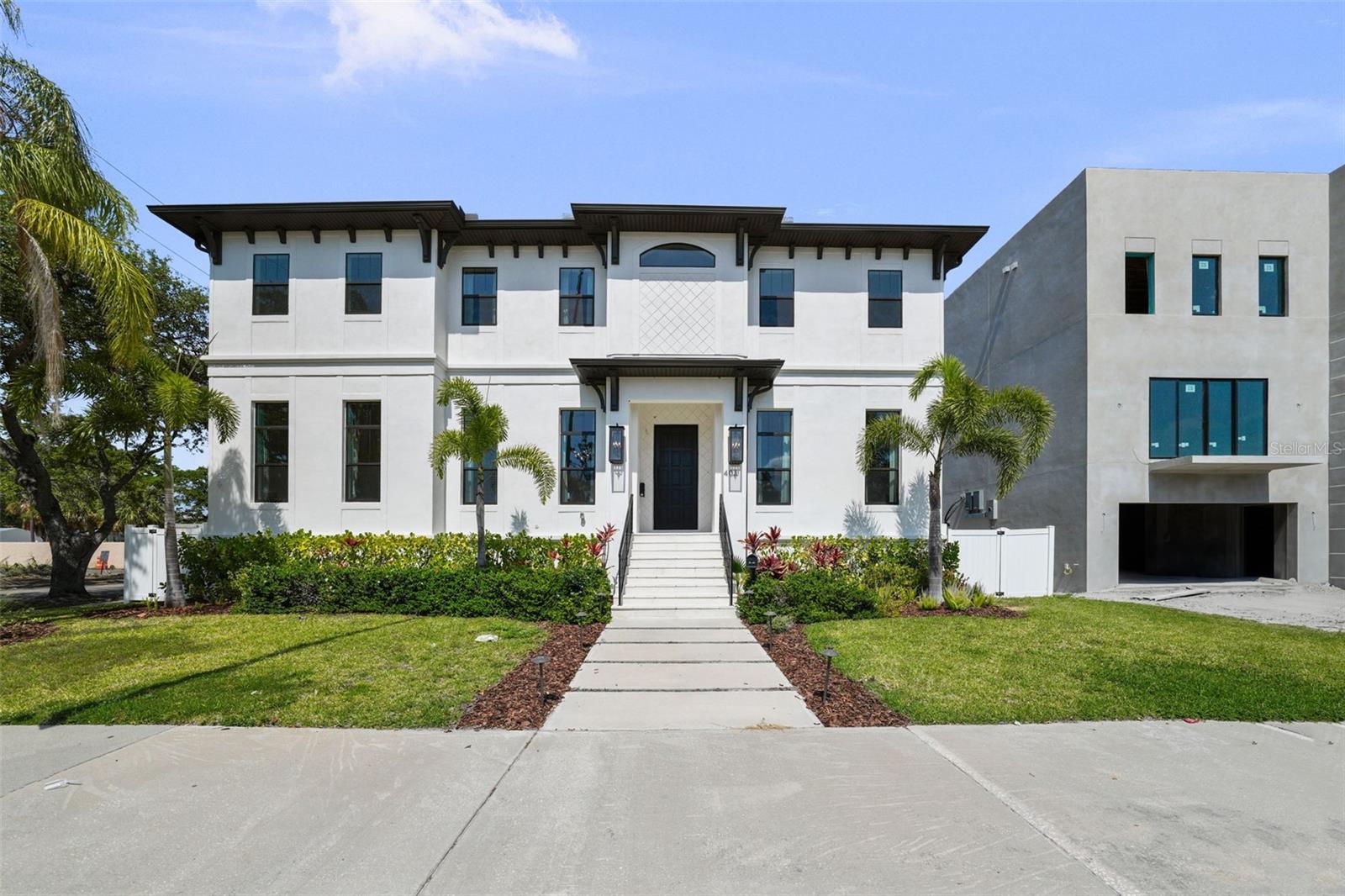 Built in 2022, this stunning 5-bedroom, 5.5-bath, 4,451 sq. ft. pool home offers modern luxury just steps from Davis Islands Village
and minutes from Downtown Tampa. Elevated 12 inches above FEMA base flood elevation, the home remained high and dry with no
water intrusion during both Hurricane Helene and Hurricane Milton—providing rare peace of mind.
Designed with an open floor plan, the home features 12’ ceilings, wide-plank French oak flooring, and large impact-rated windows
throughout. The gourmet kitchen includes Viking appliances, quartz countertops, walk-in pantry, and custom cabinetry.
The great room showcases a linear gas fireplace and a climate-controlled wine room. A first-floor guest suite with private bath and
dry bar offers ideal flexibility for use as a home office or in-law suite.
Upstairs, the spacious primary suite includes two custom walk-in closets and a luxurious bath with a vessel tub and oversized shower.
Three additional en-suite bedrooms and a bonus room complete the second floor.
Enjoy year-round outdoor living with a covered lanai, built-in summer kitchen, and a resort-style pool with sun shelf and spillover spa.
Additional highlights include a 2-car garage, tankless water heaters, upstairs storage room, and custom closet systems throughout.