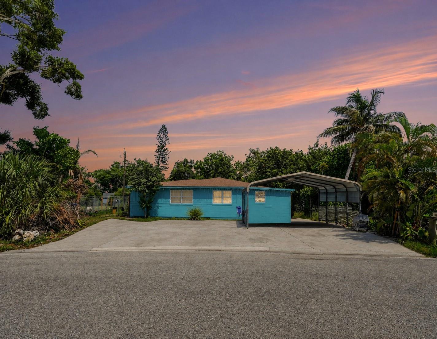 This 3-bedroom, 2-bath single-family home sits on a large lot in Bradenton with spacious living areas and plenty of outdoor space. The property features a covered carport, an extended driveway for additional parking, and a fenced yard with room for a variety of outdoor uses.

Inside, you'll find tile flooring, an enclosed bonus living area with exposed wood ceiling beams, and ample natural light. The layout offers flexibility for everyday living, with multiple gathering spaces and room to customize to your needs.

With no HOA, you'll have added freedom to use the property as you see fit. Conveniently located near shopping, dining, parks, and major roadways, this home provides easy access to downtown Bradenton, Gulf Coast beaches, and everyday conveniences.Some photos maybe virtually staged.