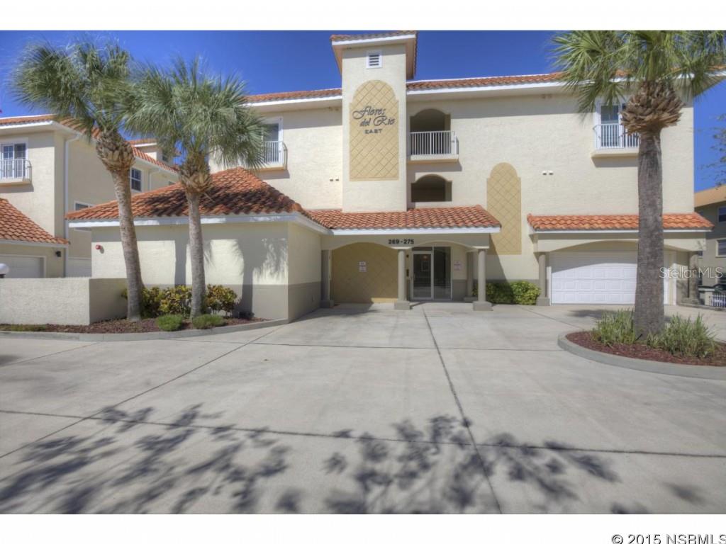 ENJOY THIS RARE OPPORTUNITY TO LIVE IN NEW SMYRNA ON THE WATER AND KEEP YOUR BOAT. This is a Boaters dream on a  deep water channel less than 250 yards from the Intracoastal Waterway. BOAT DOCK with lift included for up to 22 ft. boat. 2 buildings with 4 units each, this unit has a private loft with 2409 sq. ft. of living space, TWO car garage, TWO air conditioned storage spaces, TWO screened waterfront balcony, heated pool with infinity edge and lush landscaping. Unit features granite countertops in kitchen with ss sinks, large eat-in area, breakfast bar and generous double pantry. Carpet and 18in. tiled flooring, full size washer and dryer, cable and phone outlets in all bedrooms, living room and kitchen. Private infinity pool area.  Outstanding rental in an area close to restaurants, shops and historic Flagler Ave. ;Security: Lobby