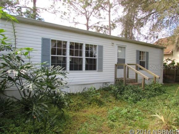 Location gives this property value and potential for new use. Access road off Newton Rd brings you to the back of the manufactured home. Property also fronts Central Park Blvd. 93'x 230' lot. Great place to build a new home. Current mobile home includes all appliances and furnishings. Split bedroom for plan. Spacious living room has cathedral ceiling, eat-in kitchen has breakfast bar & nook, inside laundry room, large master bedroom with walk-in closet and a 11'x 8' bathroom that has a double sink vanity, garden tub and shower stall. 2nd & 3rd bedrooms also have walk-in closets. 2nd full bathroom has tub. Kitchen sliding glass doors lead out to 20'x 20' patio. Also includes a storage shed.Huge 1/2 Acre lot with a 1996 mobile home in great location. Walking distance to All Children's Park, Tennis Courts, Baseball Fields, and Neighbor's Ice Cream Store. Zoning allows for single family homes, so you could buy with a view to build your future home. Also available MLS # 1019722 - 575 Newton Rd (home located behind this one). Both lots will give you an acre property. ;Water: City