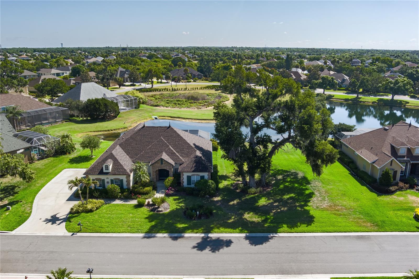 Tucked inside the gated community of Oak Creek, this 3 bedroom, 3 bath pool home sits on a rare double lot overlooking the lake just under half an acre of space, privacy, and beautiful views. Homes in this small, established neighborhood are known for their presence and curb appeal, and this property is no exception with its lush, mature landscaping that creates a peaceful, private setting.

Inside, the home offers a spacious and functional layout with a true split floor plan. You’ll find a formal living room, dining room, and a comfortable family room that flows into an open kitchen—perfect for everyday living and entertaining. Crown molding runs throughout, adding a finished touch, and there is also an indoor laundry room for convenience.



The third bedroom and full bath have direct access to the pool area, making it ideal for an in-law suite or private guest space. In addition, there is a separate den that could easily serve as a fourth bedroom, office, or flex space depending on your needs. The primary suite is generously sized and features a soaking tub, creating a relaxing retreat.

Step outside to the screened pool and enjoy the lake views and the natural privacy the oversized lot provides. The setting truly feels tucked away while still being in a prime location. A brand new roof has already been completed, giving buyers a strong head start.

This home is ready for its next owner to add their personal touches inside and out while enjoying the solid layout, exceptional lot, and highly desirable location. Convenient to I-75, shopping, dining, and within easy reach of St. Petersburg, Tampa, and Sarasota.