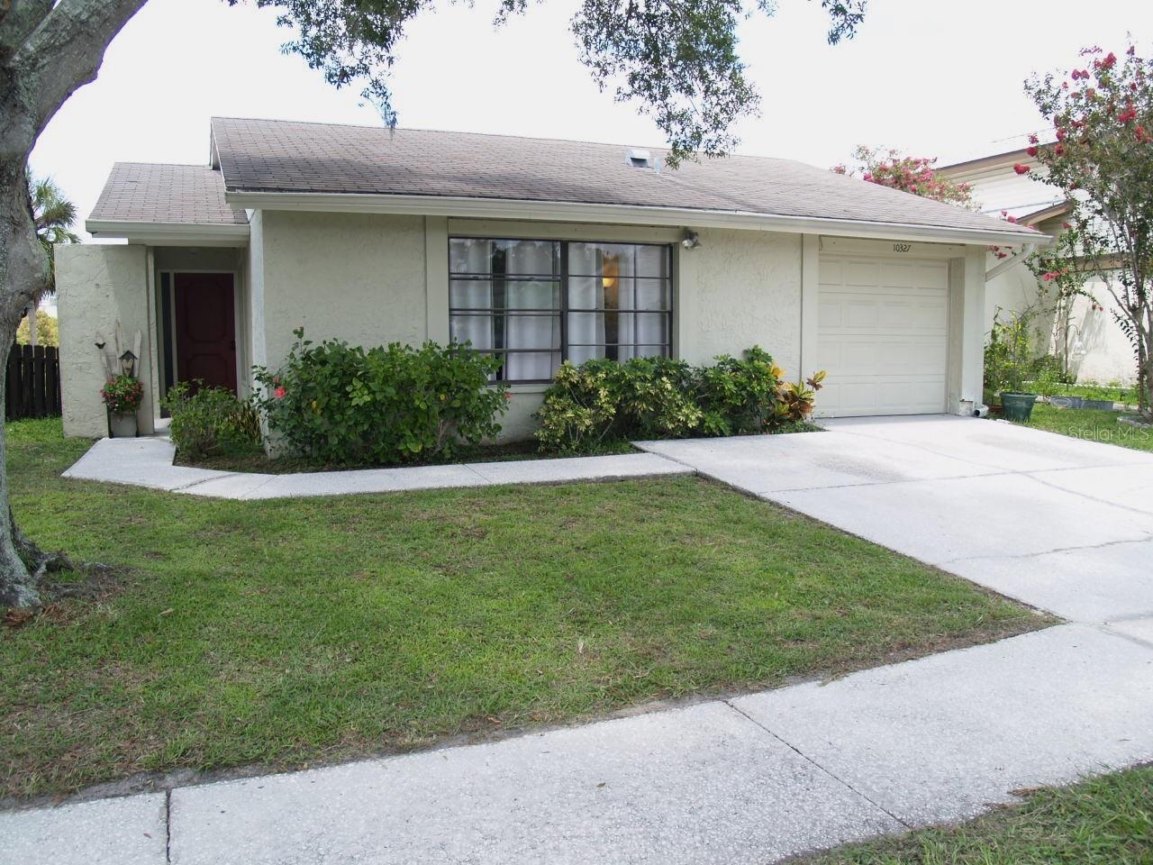 A new roof was installed in November. The home is conveniently located to everything in Carrollwood and downtown Tampa (20 minute drive).  Access to Veterans Expressway is literally around the corner which delivers an easy Commute to Tampa International Airport, downtown Tampa and quick routes to the Gulf Coast’s sandy beaches. Nightly picturesque sunsets over a welcoming pond.  Welcome to 10327 Chadbourne Drive, A WATERFRONT PROPERTY in the heart of “The Plantation of Carrollwood”, a deed restricted community with a mandatory homeowners association. LOOK AT THE VIEW!!!! This inviting home in the desirable Plantation community is located on a desirable waterfront (pond) lot. This Florida three bedroom, two bathroom home delivers an open floor plan with a large great room, dining area, and a cozy kitchen that is perfect for the interested future homeowner.  Step inside and you will be impressed by the spacious and well-designed interior. You must take the time to walk through the large screened Lanai to enjoy the backyard which fronts a sizable pond/la.  Imagine yourself spending an evening watching a prismatic sunset while enjoying the serenity of the outdoors.  The sunsets are simply stunning. This desirable community consists of 18 villages on 520 acres of land.  You will enjoy the use of 119 acres of common areas throughout the community including:  55 acres of lakes and 64 acres of recreation spaces which include the clubhouse, tennis courts, baseball, volleyball and soccer fields; swimming pools, handball/racquetball courts and playgrounds.  The walking paths are extensive as well as the fishing opportunities from your back yard.  The Clubhouse can be rented to host events.    All offers to be submitted on "AS-IS Residential Offer" form.   See the attachment on the Flood Zone Determination.  Do not enter the property without the permission of the indicated listing agents. The property is occupied and a good size dog is housed there.  Thankyou.  ALSO -- The owner has conducted a complete home inspection and has fixed the deficiencies listed.