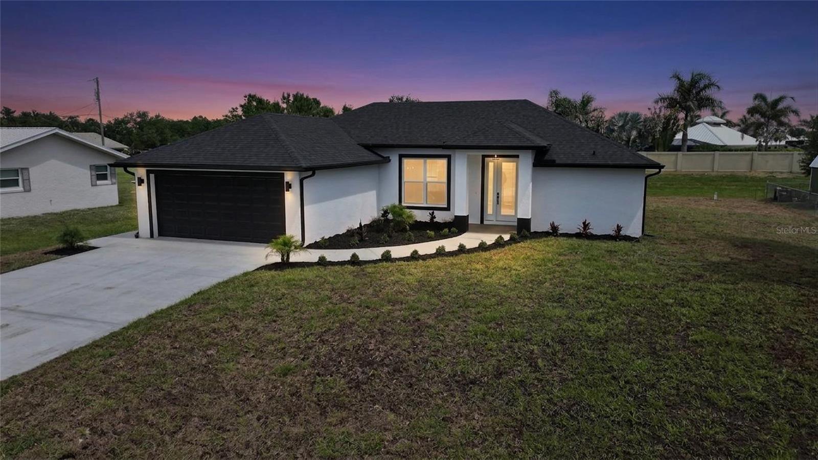 This 2026 3-bed, 2-bath home is a standout in DeSoto County’s new builds. High ceilings and an open floor plan set the tone, while the living room’s expansive sliding doors disappear, merging indoor and outdoor living. The kitchen features granite, an oversized island and soft-close cabinets, while the two-car garage—rare for the area—adds practicality. All appliances are included, even the washer and dryer. The primary suite has tray-style ceilings, porch access, a custom walk-in shower, and two walk-in closets. Plus, there’s an indoor laundry room and both guest bedrooms are super spacious! Outside, fresh landscaping and a polished front walk deliver curb appeal for that luxury feel without the luxury price. Perfectly located for easy access to Arcadia, Punta Gorda, I-75, airports, beaches, medical facilities, the best SWFL restaurants and the Peace River boat ramp. Yours for $349K!