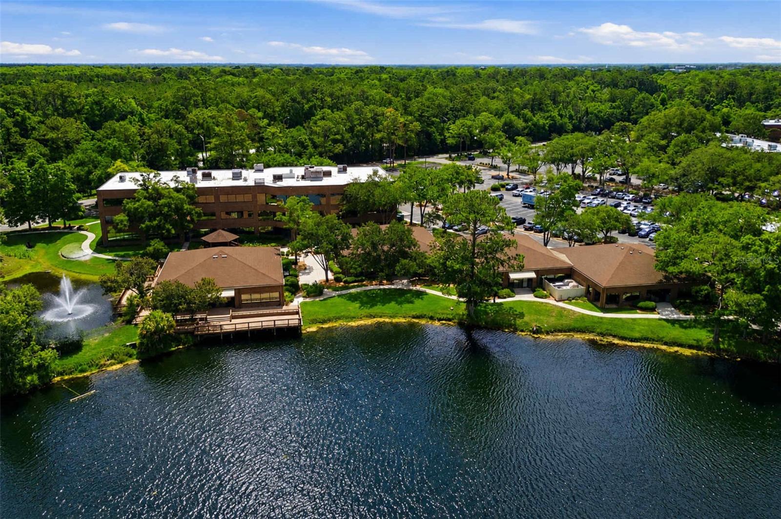 One or more photo(s) has been virtually staged. Rare opportunity to acquire a stabilized ±18,510 SF two-building lakefront office/flex investment property located within Jacksonville's highly sought-after Baypine / Deerwood business corridor. Situated on a professionally maintained waterfront campus with abundant parking, mature landscaping, and immediate access to Interstate 95 and Butler Boulevard (JTB), the property consists of both a ±13,704 SF main building and a ±4,806 SF building. Recent ownership capital improvements, strong curb appeal, and a strategic location within one of Jacksonville's premier office submarkets position this asset as a compelling long-term investment opportunity.

The property is 100% occupied by a long-term established organization with more than 15 years of occupancy history and a recently exercised renewal option, providing stable in-place cash flow through a Triple-Net (NNN) lease structure with contractual 5% annual rent escalations. The offering presents an attractive 6.59% cap rate based on current income, with projected NOI growth through future rent escalations and additional upside potential from below-market in-place rental rates.