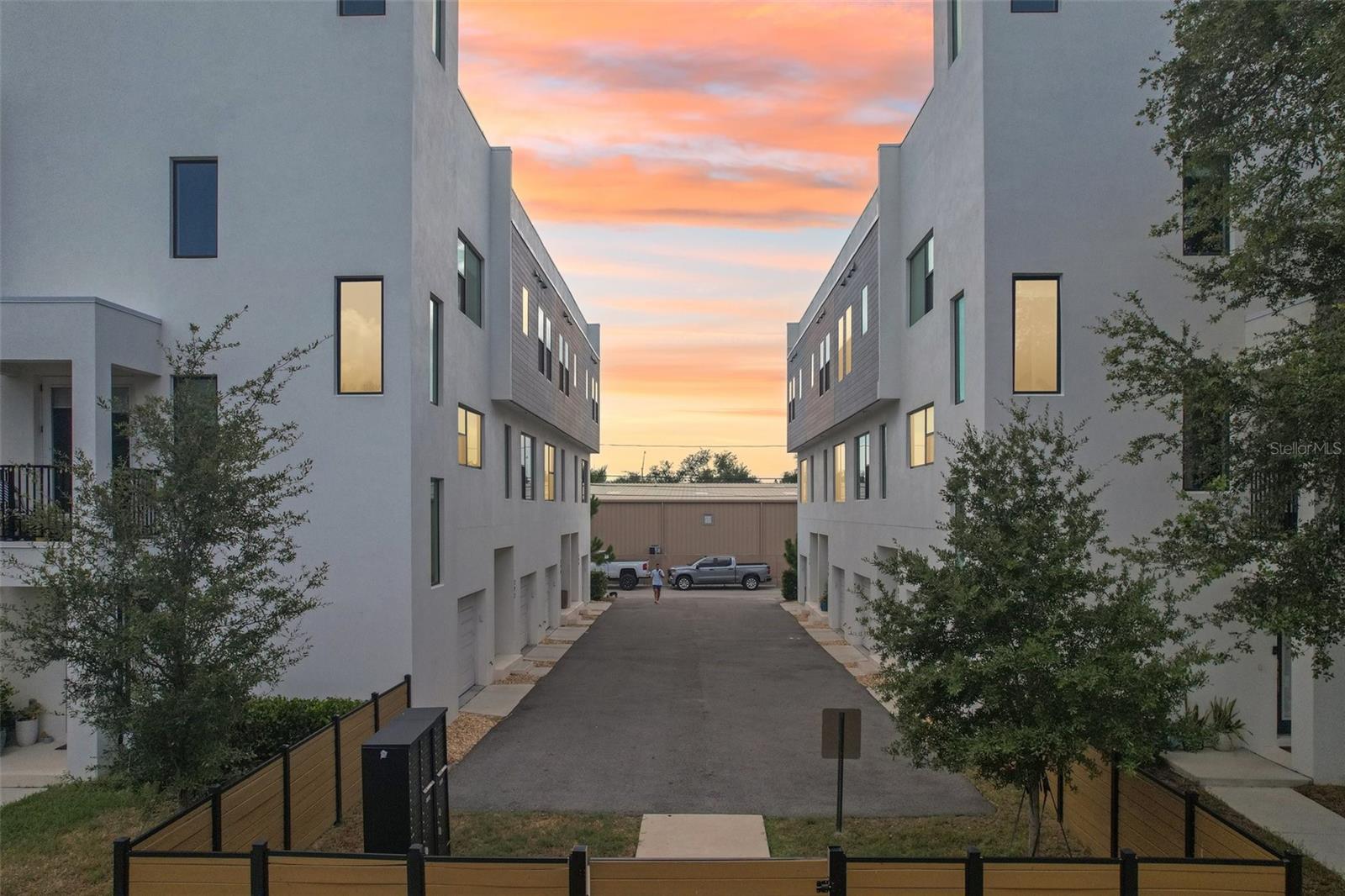 Rooftop sunsets, modern lines, and a lock-and-leave lifestyle just minutes from downtown St. Pete. Welcome to this 2023-built townhome in the boutique Alante community where nearly every detail is already done for you. Three finished levels plus a private 20x33 rooftop terrace with a wet bar and retractable cover, your own open-air lounge for morning coffee and golden-hour gatherings. The second-floor living space is bright and open, anchored by a chef-friendly island kitchen that flows to dining and a spacious living room wired with a home cinema setup that conveys. Upstairs, the primary suite offers a walk-in shower and generous closet, with a second ensuite-style bedroom and a dedicated laundry room on the same level. A first-floor bedroom and full bath make a perfect guest suite, office, or gym, and the attached garage adds everyday ease. Located in flood zone X, this home offers real peace of mind and lower insurance costs, a rare advantage in today's market. Electric shades upgrade ($5,000) Retractable Cover ($5,000), washer and dryer, bar refrigerator, and living room, patio furniture all convey, so you can simply move in and start living. Walkable to shops and dining, close to St. Anthony's and I-275. Turnkey, modern, and priced to move. Come see it before it's gone.