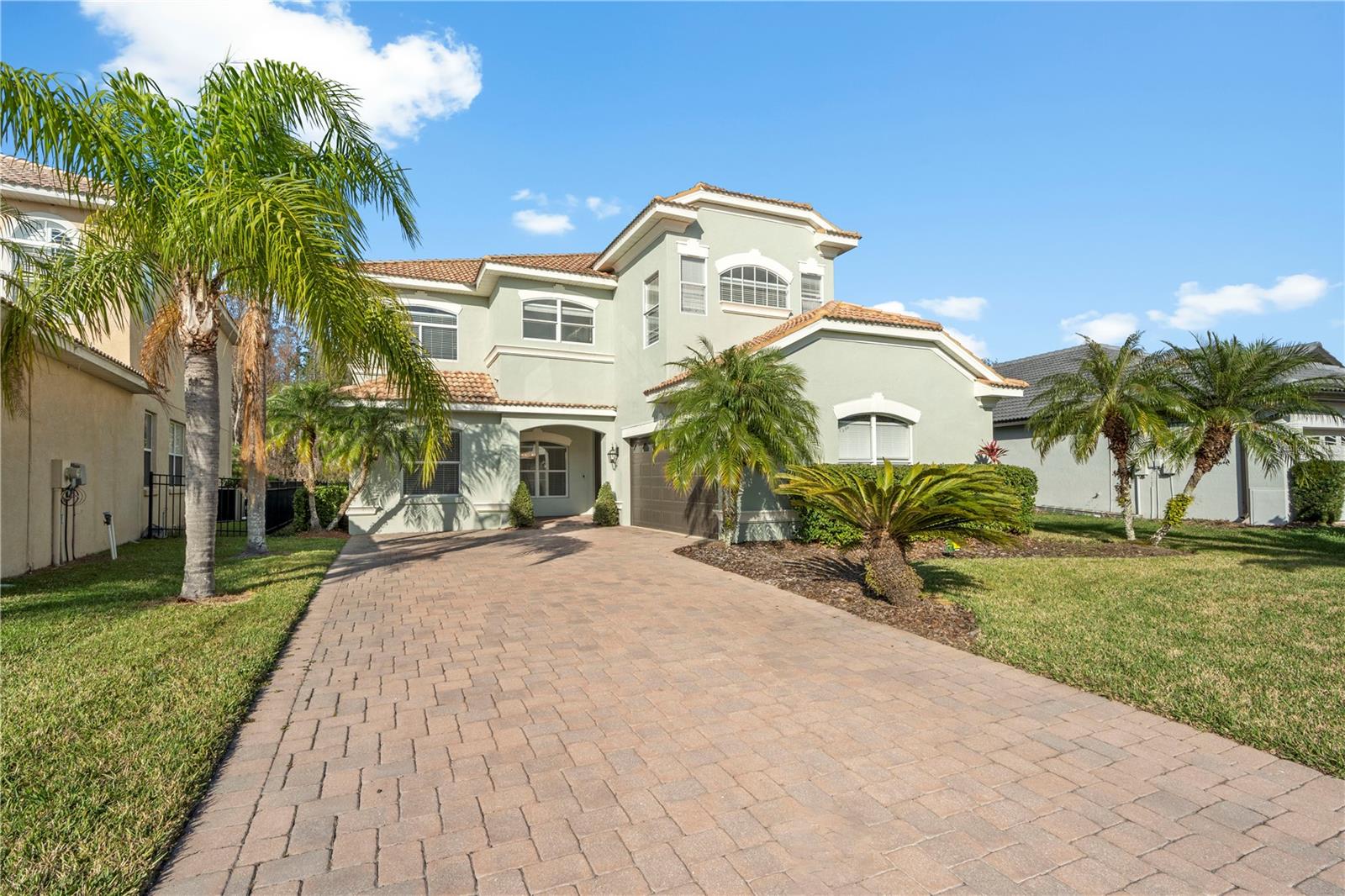 Virtually Staged. Experience luxury living in this freshly updated 5-bedroom, 4-bathroom pool home, located in the sought-after gated community of Cory Lake Isles. Situated on a beautifully landscaped 0.18-acre lot, this spacious home has been thoughtfully refreshed with brand-new flooring and a fresh coat of paint throughout, offering a clean, modern aesthetic that’s move-in ready. The open-concept layout flows seamlessly to the covered lanai and fully equipped summer kitchen, perfect for outdoor entertaining or relaxing poolside in your private backyard oasis. Cory Lake Isles is known for its resort-style amenities, including 24-hour manned gated security, a stunning lakeside clubhouse, state-of-the-art fitness center, playgrounds, tennis courts, roller hockey rink, beach volleyball court, boat ramp, and private beach area. This pet-friendly community (with some restrictions) provides the perfect setting for active lifestyles and family fun. Located just minutes from I-75, University of South Florida (USF), Moffitt Cancer Center, AdventHealth, and Florida Hospital, this home offers unparalleled convenience to top-rated medical centers, shopping, dining, and entertainment. Whether you're commuting or looking to enjoy everything New Tampa has to offer, this location checks all the boxes. Don’t miss your chance to live in one of Tampa’s premier master-planned communities. Call today to schedule your private showing and make this dream home your reality!