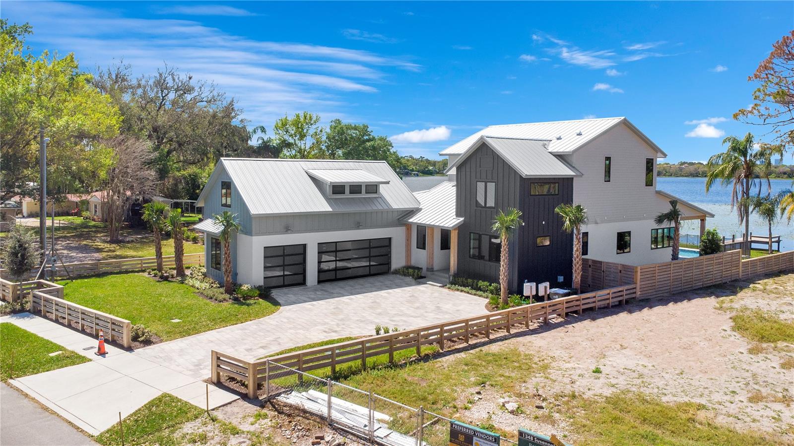 Accepting back up offers, request a showing! Lakefront Luxury on Private, Skiable Lake Susannah!

Experience the pinnacle of waterfront living in this exceptional, custom-designed estate on the shores of Lake Susannah—a private, spring-fed, 78-acre skiable lake known for its pristine waters and peaceful charm. Perfectly positioned to capture sweeping views of the downtown Orlando skyline, this one-of-a-kind residence offers unforgettable Florida sunsets from the comfort of your own resort-style retreat.

The 42-foot pool and spa stretch along the lakefront, designed with sunset-facing bench seating that transforms every evening into a cinematic lakeside experience. Surrounded by lush tropical landscaping, elegant Queen palm trees, and a beachside firepit, the backyard is a true sanctuary—complete with a private dock, ready and waiting for your ski boat. With three distinct outdoor living areas, this home invites effortless entertaining and everyday relaxation all year long.

Inside, no detail has been overlooked. A striking modern staircase serves as the architectural centerpiece of the main living space, where six fully collapsible doors seamlessly connect the indoors to the outdoors, flooding the home with natural light and offering an uninterrupted flow to the expansive lakefront terrace. A dry bar and glass-enclosed wine room add sophistication and functionality, perfect for elevated entertaining.

The primary suite and an additional first-floor guest suite offering convenience and privacy, while the primary dressing room is beyond compare—expansive, elegant, and virtually endless in storage capacity. The gourmet kitchen is both stunning and functional, featuring a hidden walk-in pantry, designer vent hood, built-in refrigerator, and an abundance of custom cabinetry that delivers exceptional form and function. Each additional bedroom offers generous proportions and its own luxurious ensuite bathroom.

The striking three-car garage boasts luxurious designer doors that gleam on the exterior. Upon opening these doors, you are welcomed by extraordinary custom metallic-finished floors! Above, there's a detached bonus suite, perfect for a private gym, art studio, in-law suite, or executive office.

Set just a short stroll from the vibrant Baldwin Park Village Center, and mere steps from the scenic Cady Way Trail, this home delivers unmatched access to the best of Downtown Orlando and Winter Park, while offering the privacy, exclusivity, and serenity of a lakefront sanctuary.

This is more than a New home—it’s a statement and lifestyle. A rare blend of architectural excellence, modern luxury, and refined lakefront living. Welcome to your forever view on Lake Susannah. More pictures to come, call your Realtor for a schedule showing today!