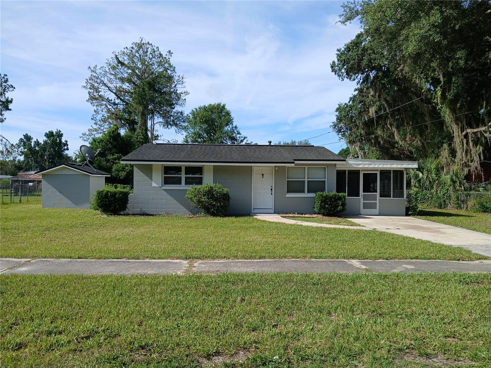 Take a look at this solid concrete block home which includes a new mini-split A/C unit and new windows in the two bedrooms. There is also a screened-in carport so you can enjoy fresh air in the evenings. The home is also fenced on 3 sides so you would only need to fence the front. This neighborhood is only a few miles from downtown Inverness where you will find Historic streets with shops and restaurants. Liberty Park and the Depot District are also downtown, where weekends feature concerts and festivals along the lakefront. Come see this one.