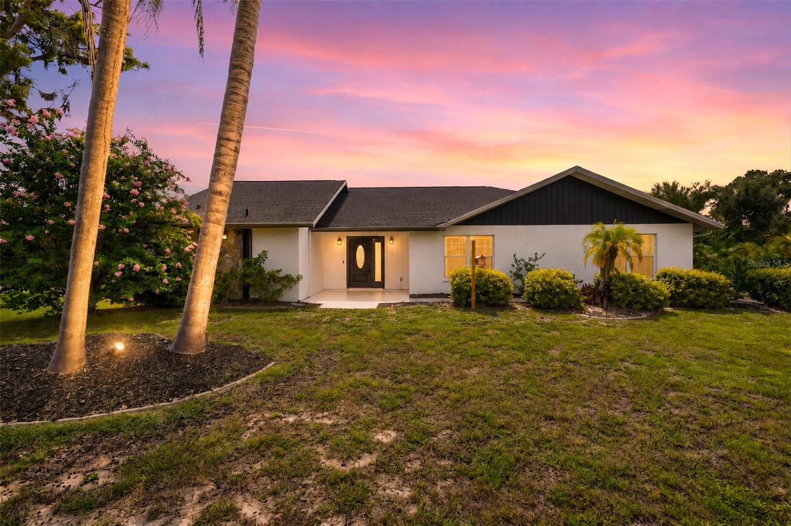 Tucked beneath a canopy of mature oak trees in one of Nokomis' most established neighborhoods, this spacious 4-bedroom, 3-bath pool home offers the rare combination of space, privacy, and freedom in a location that's becoming increasingly difficult to find. With nearly 2,800 square feet of living space, a new roof (2023), HVAC (2025), water heater (2026), and a desirable split-bedroom floor plan, many of the major updates have already been completed, leaving the perfect opportunity to personalize the cosmetic finishes to your own style. Inside, soaring vaulted ceilings and a striking stone wood-burning fireplace create a warm, inviting focal point for the main living area. The generous primary suite offers private access to the screened pool and spa, while an additional office/flex room provides the versatility to work from home, create a hobby space, or accommodate guests. The oversized garage includes a dedicated workshop and extra storage for projects, hobbies, and recreational gear. Step outside to your private screened lanai, where the pool and spa overlook a peaceful wooded setting designed for relaxing or entertaining. One of the standout features of this property is the freedom it offers—bring your boat, RV, trailer, and recreational toys, or even keep backyard chickens, all without restrictive HOA rules. Located just minutes from Nokomis Beach, the Legacy Trail, Oscar Scherer State Park, shopping, dining, and highly rated schools, this home offers the perfect blend of peaceful living and everyday convenience. If you've been searching for a property with great bones, timeless character, and the chance to make it your own in an unbeatable location, this is one you won't want to miss.