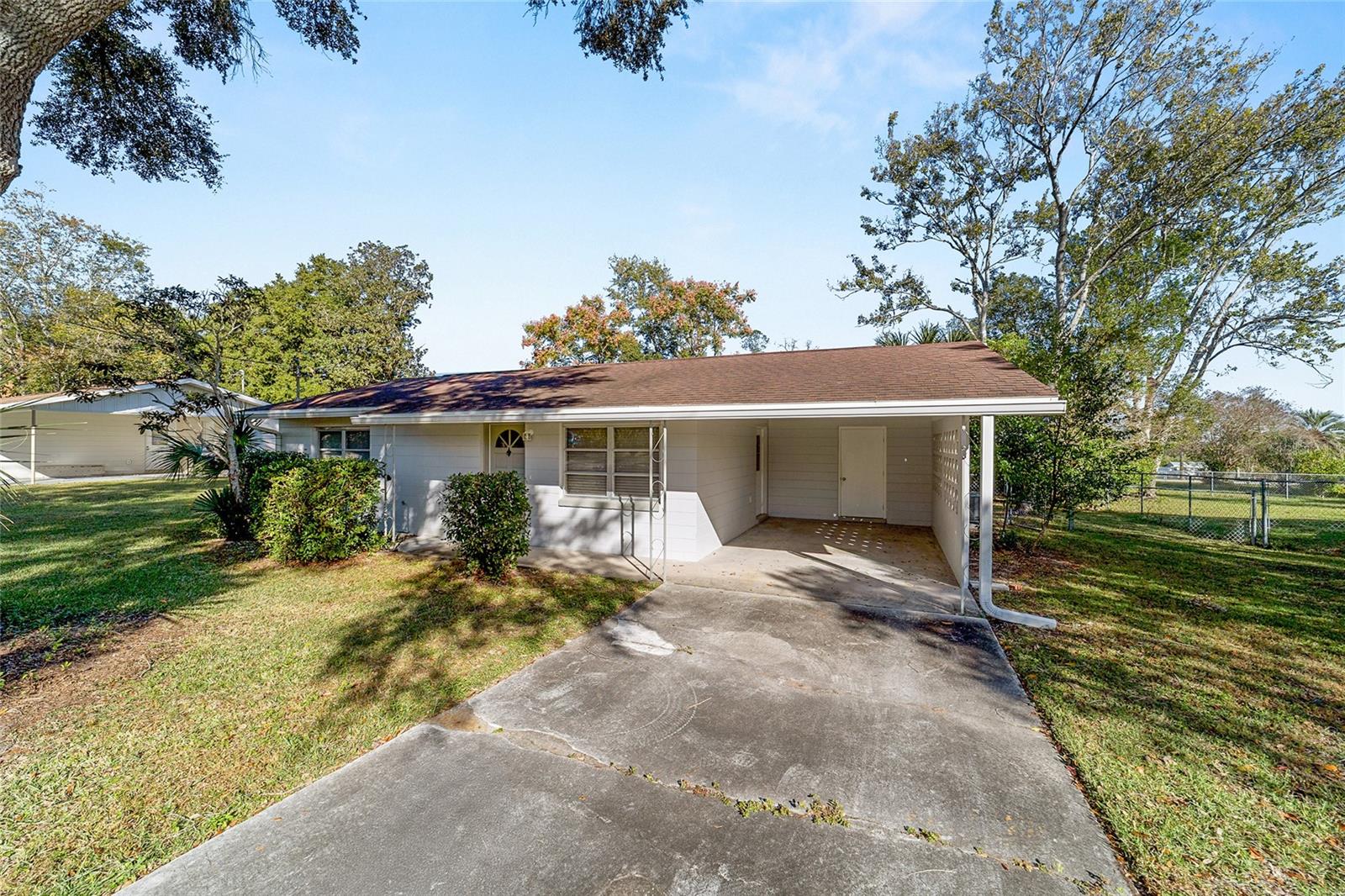 Discover this lovingly maintained home in Rainbow Lakes Estates. This quaint abode is move-in ready and offers many upgrades including hard floors throughout, new roof (2017), and newer HVAC. The kitchen features plenty of counter and cabinet space for storage and functionality. Off of the kitchen, you will find a spacious (9x14) enclosed lanai perfect for enjoying your morning cup of coffee. Outside the home, the fully fenced back yard provides a great space for your furry friends.  Rainbow Lakes Estates is located within 15 minutes of the Rainbow Springs State Park and within 20 minutes of the Withlacoochee River making it a perfect spot for the Outdoor enthusiast.  Enjoy no HOA and no flood zone!