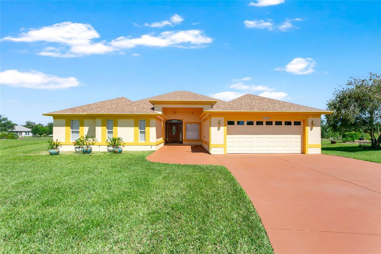 Welcome to waterfront living at its finest in the highly sought-after, gated community of The Plantation at Leesburg. Located in the cul-de-sac enclave of Summerbrooke, this meticulously maintained, beautifully renovated home is tucked near the rear entrance and surrounded by just six other homes—creating a quiet, private setting with a true sense of community.

Featuring 3 bedrooms, 2.5 bathrooms, and a spacious Florida room with panoramic pond and conservation views, this home is designed for both everyday comfort and effortless entertaining. Natural light fills the interior, highlighted by soaring ceilings, crown molding, custom fixtures, and a seamless blend of porcelain tile and wood flooring throughout.

The thoughtfully designed layout includes two primary suites, with the main suite offering serene water views and a spacious en-suite bath complete with a large walk-in shower and dual vanities. The open kitchen serves as the heart of the home, featuring 42-inch cabinetry, Corian countertops, a center movable island all flowing effortlessly into the dining area with tranquil water views.

Additional highlights include extraordinary custom closet systems in all bedrooms, an oversized garage, low-maintenance landscaping, a new roof (2022), AC (2016), and a recently painted interior and exterior. The Florida room creates the perfect setting to relax and take in the peaceful surroundings.

Wait until you see the details that truly set this home apart—the current owners’ meticulous attention to detail and pride of ownership shine through in the extraordinary, interchangeable shelving systems featured in each of the exceptional closets, offering both beauty and functionality.

This home has truly been the owners’ pride and joy, and their care is evident throughout. While they are heartbroken to leave, it presents a rare opportunity for the next owner. And as an added bonus, you’ll enjoy some of the best neighbors around… one even offers free pickleball lessons!

An added benefit: the home offers an assumable VA loan at an attractive 2.75% interest rate for qualified buyers.

Residents of The Plantation enjoy a true resort-style lifestyle with access to golf, multiple pools, fitness centers, an on-site restaurant, tennis, pickleball, softball, shuffleboard, and a wide variety of clubs and social activities.

This is a rare opportunity to own a fully updated waterfront home in one of Central Florida’s most active and welcoming communities.