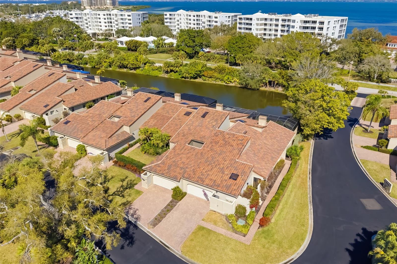 PRICE IMPROVEMENT – REDUCED $99,000!

Discover refined coastal living in this impeccably maintained, fully furnished end-unit villa on Longboat Key, now offered at an exceptional new value following a $99,000 price reduction. Offering nearly 2,400 square feet of thoughtfully designed living space, this residence combines the privacy and feel of a single-family home with the ease of maintenance-free living, all just moments from the Gulf's pristine beaches.

Vaulted ceilings, abundant natural light, and an open floor plan create an inviting atmosphere throughout. Multiple living and entertaining areas include a formal living room with a wood-burning fireplace and expansive sliding glass doors leading to a spectacular 740-square-foot private terrace overlooking tranquil pond views.

Timeless coastal finishes include rich wood flooring, plantation shutters, granite countertops, updated cabinetry, and a skylight that fills the kitchen with natural light. Recent improvements include a new roof and new air-conditioning system, both completed in 2025.

Two private atriums add architectural character and natural beauty, while a versatile office with a built-in Murphy bed can easily serve as a fourth bedroom. The spacious primary suite offers a private retreat, complemented by comfortable guest accommodations.

Additional features include a private two-car garage with organized storage, a heated community pool and spa, and exclusive membership to the gated Bay Isles Beach Club with private Gulf-front beach access and dedicated parking.

Ideally located near world-class beaches, boating, waterfront dining, and the renowned Longboat Key Club's golf, tennis, pickleball, marina, and dining amenities, this exceptional residence offers the ultimate island lifestyle.

Private, elegant, fully furnished, and now priced to sell, this is a rare opportunity to own one of Longboat Key's most desirable villa residences.