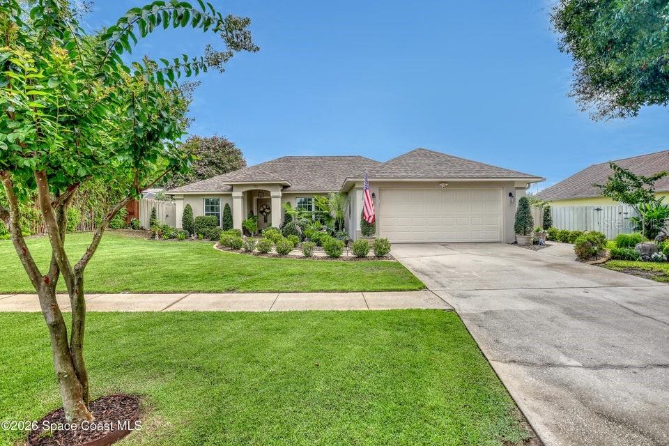 Make this Home yours in the sought after Oaktrails at Meadowridge! This beautifully done 3 br/2ba home shows much pride of ownership! Features include stainless appliances and ample storage in Kitchen, along with seating around the kitchen bar area. Sunny dining area with views to the backyard. Extra space used now as a conversation area, could have many uses. Primary bath includes soaking tub and separate shower, double vanity, Large walk in closet. Laundry room affording additional storage. Two car garage. From the living area, is the screened porch with tile floors, Enter into your tropical oasis with many plantings including the Australian Tree Ferns and colorful Boganvilla. Soak your cares away in the covered Hot Tub area! Two sheds in the fenced yard.. Enjoy rocket launches from your own backyard! Centrally located to theme parks, Orlando area, Beaches, Port Canaveral Cruise Terminals and Kennedy Space Center.. Take in the thoughtful plantings with water features!